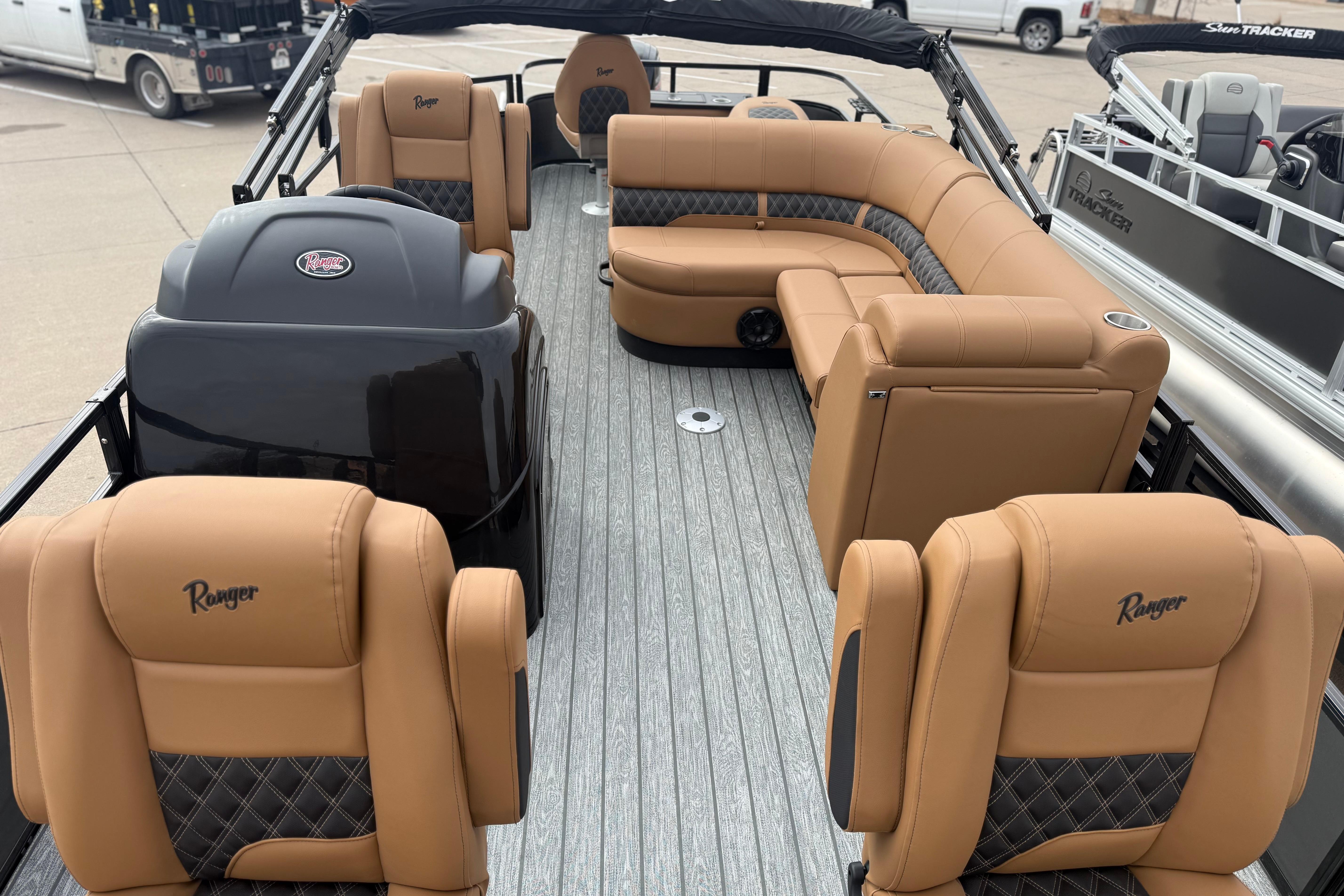 2026 Ranger 220F boat interior with tan leather seating and modern design.