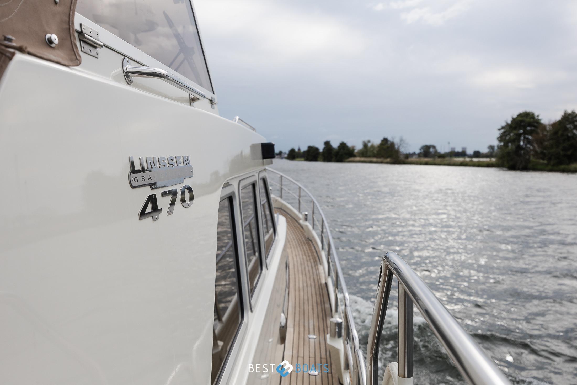 2010 Linssen Grand Sturdy 470 AC Mark II Twin cruising on a serene waterway.