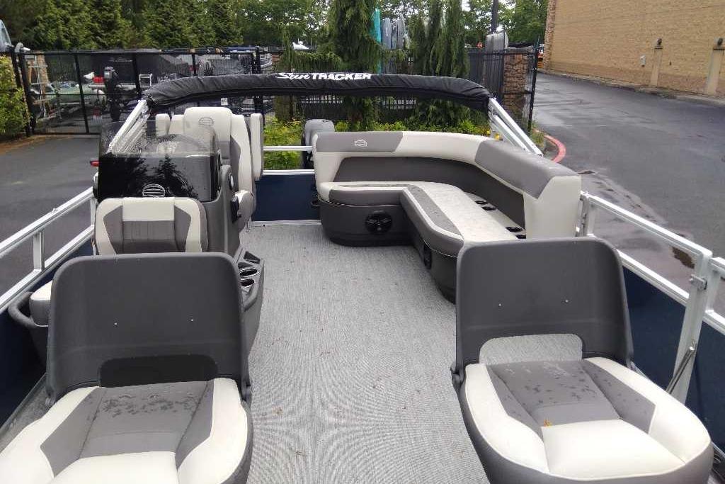 2026 Sun Tracker Bass Buggy 16 XL Select pontoon boat interior with seating and helm.