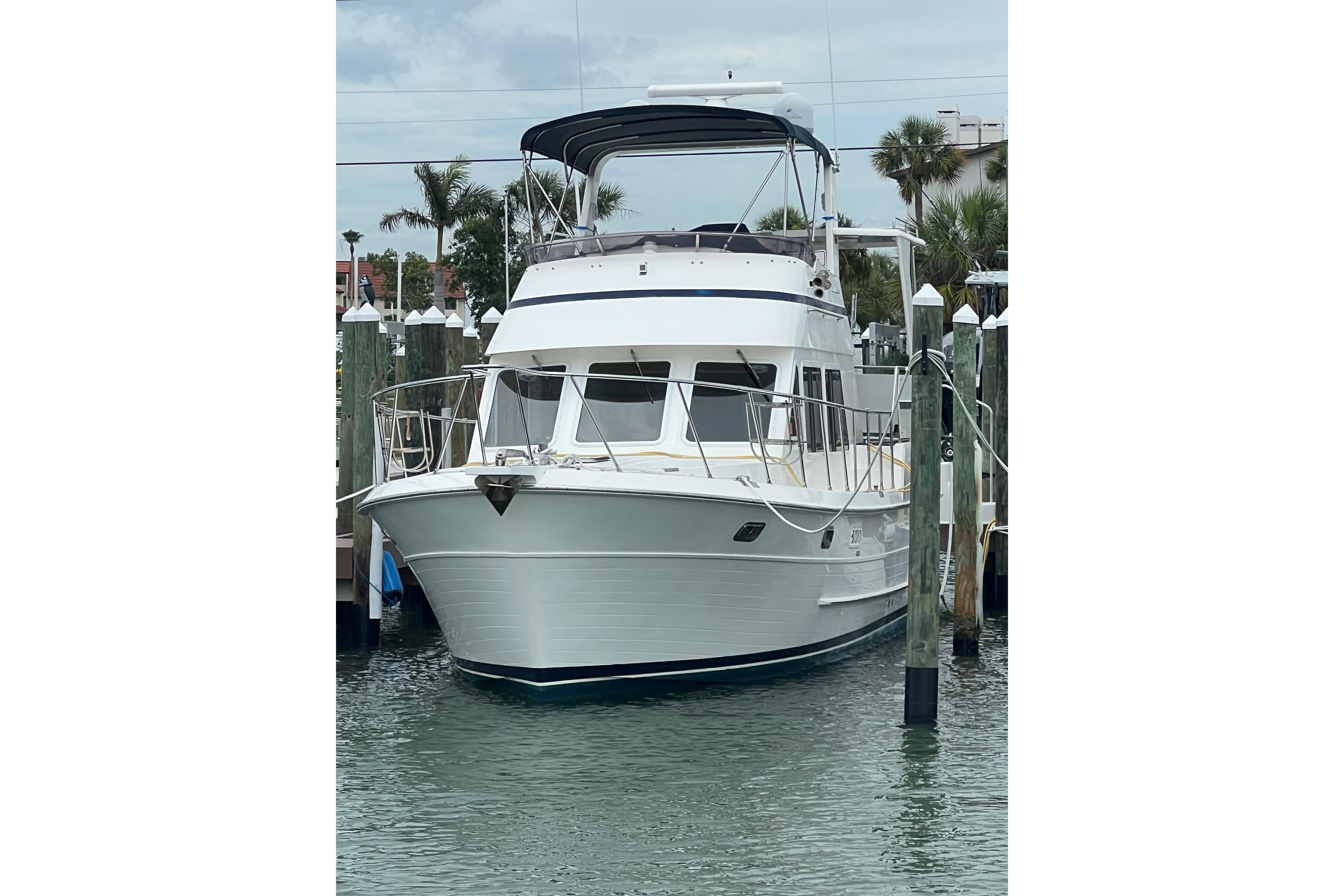 2007 Heritage East 36 Sundeck Trawler docked at marina, front view.