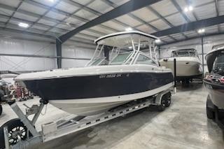 2022 Robalo R247 Dual Console boat in indoor storage on a trailer.