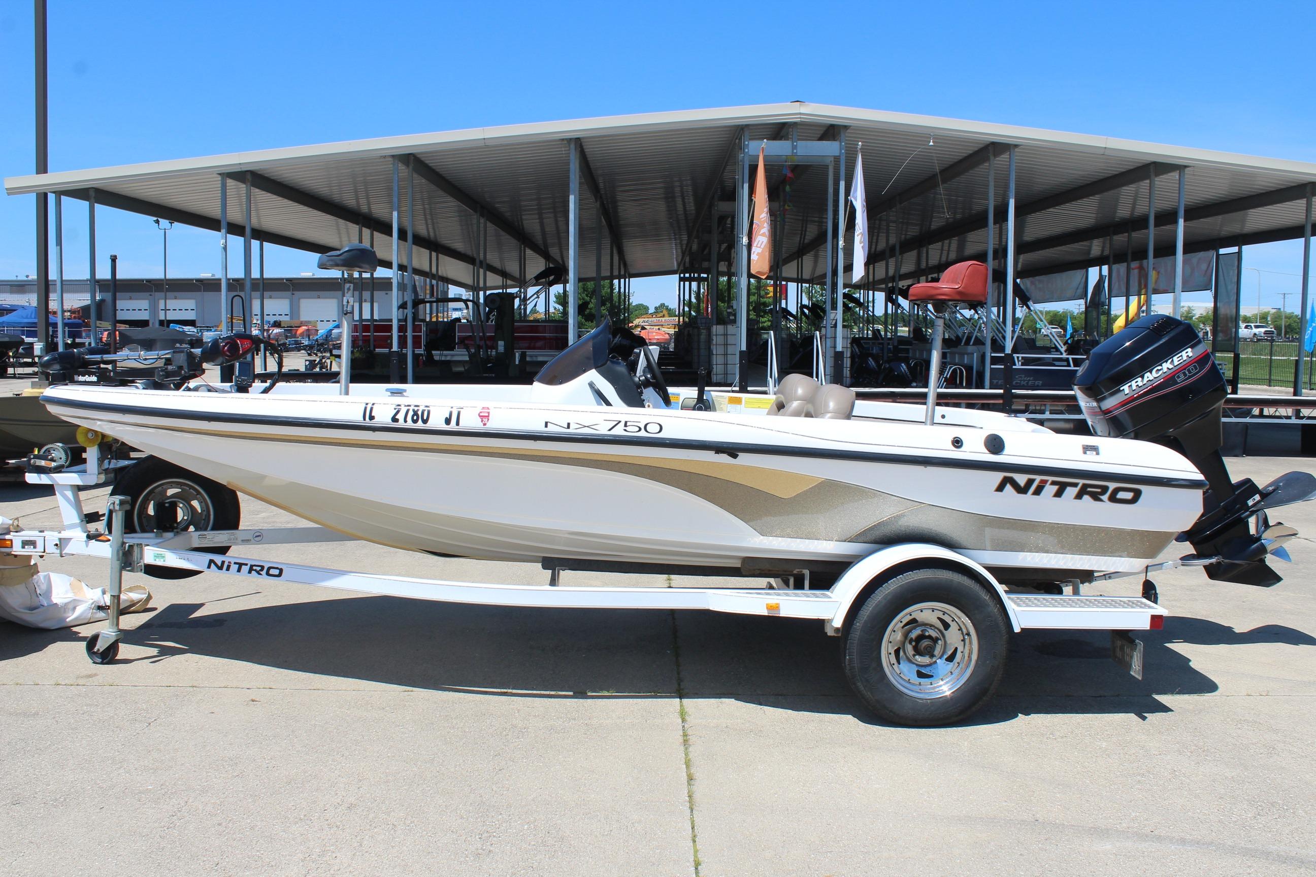 2003 Nitro NX 750 SC boat on trailer, parked outdoors under a canopy.
