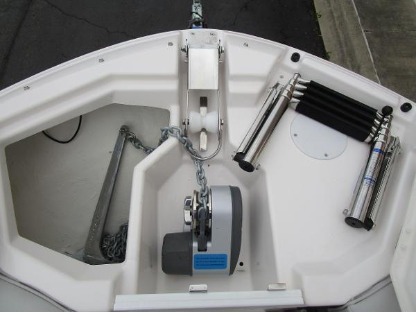 Bow of 2025 Solara S-250 CW boat with anchor and chain mechanism.
