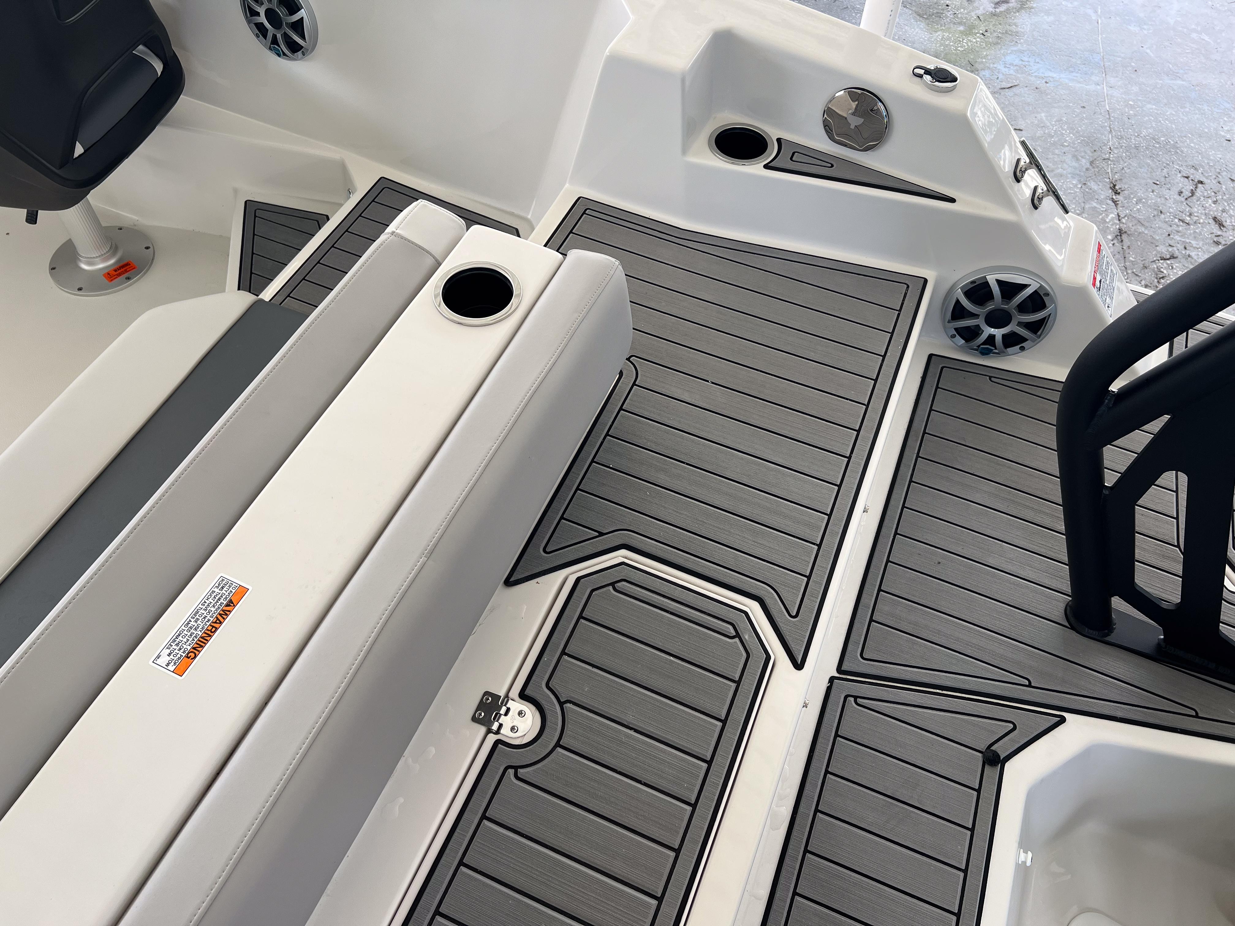 2026 Starcraft SVX 231 OB boat interior with gray decking and seating area.