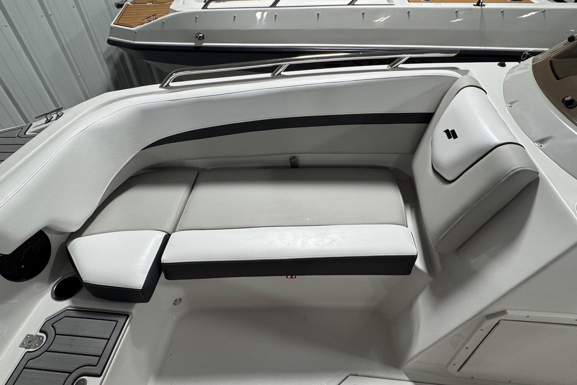 2026 Starcraft SVX 191 OB boat interior with white cushioned seating and sleek design.