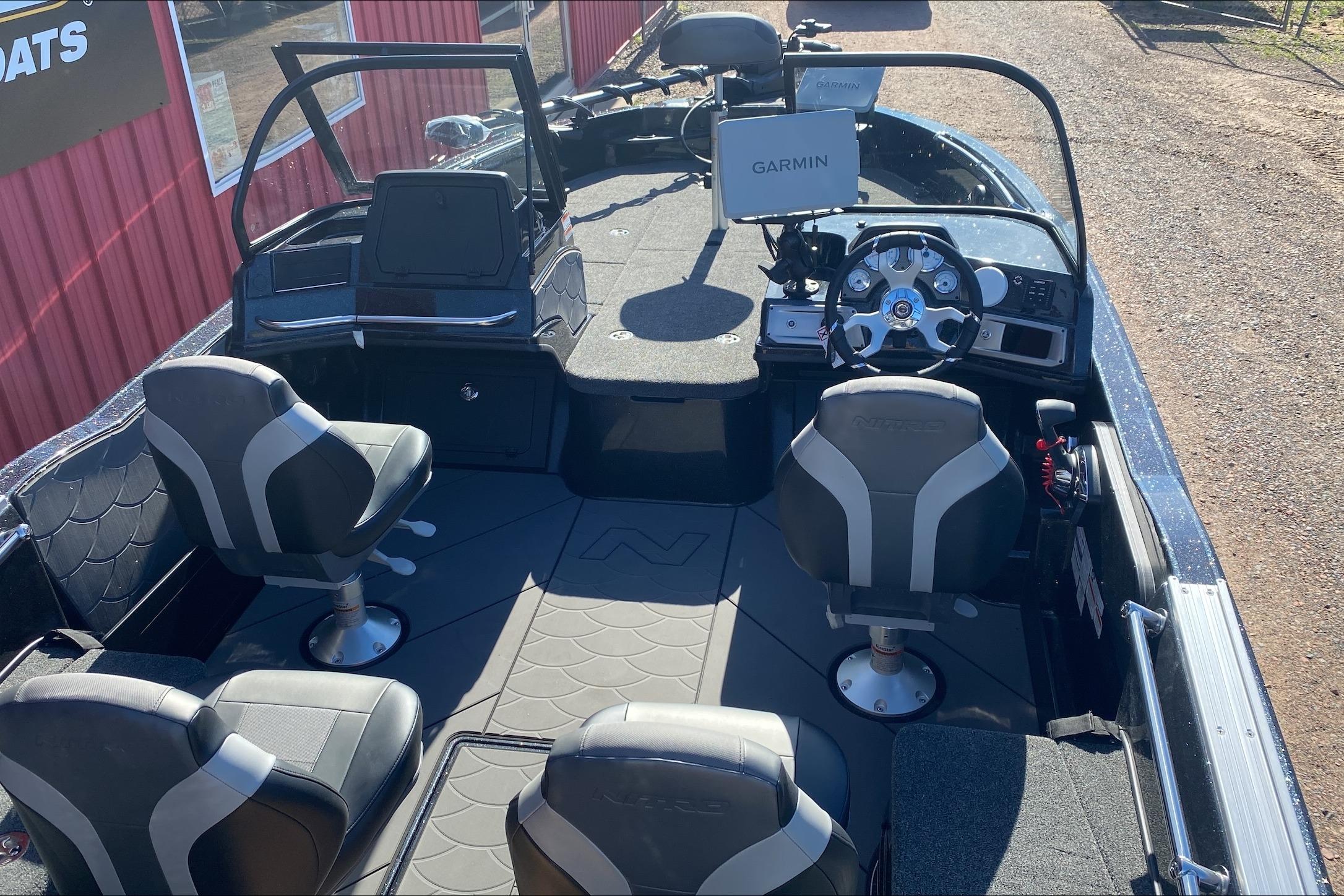 Interior of a 2026 Nitro ZV20 Pro boat with seating and Garmin navigation system.