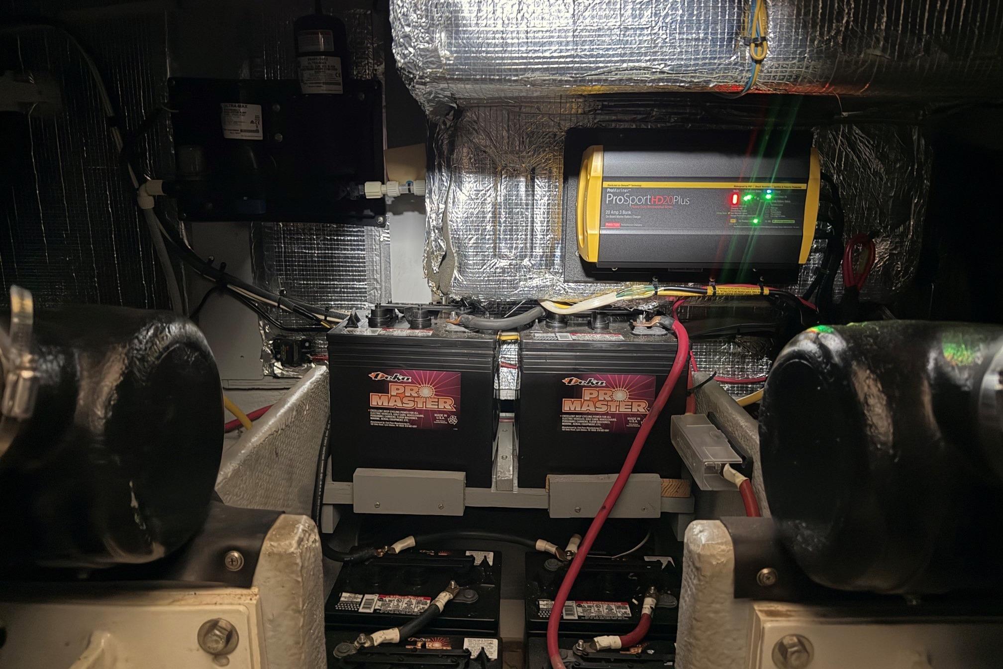 Engine room of 2004 Silverton 39 Motor Yacht with batteries and ProSport charger.