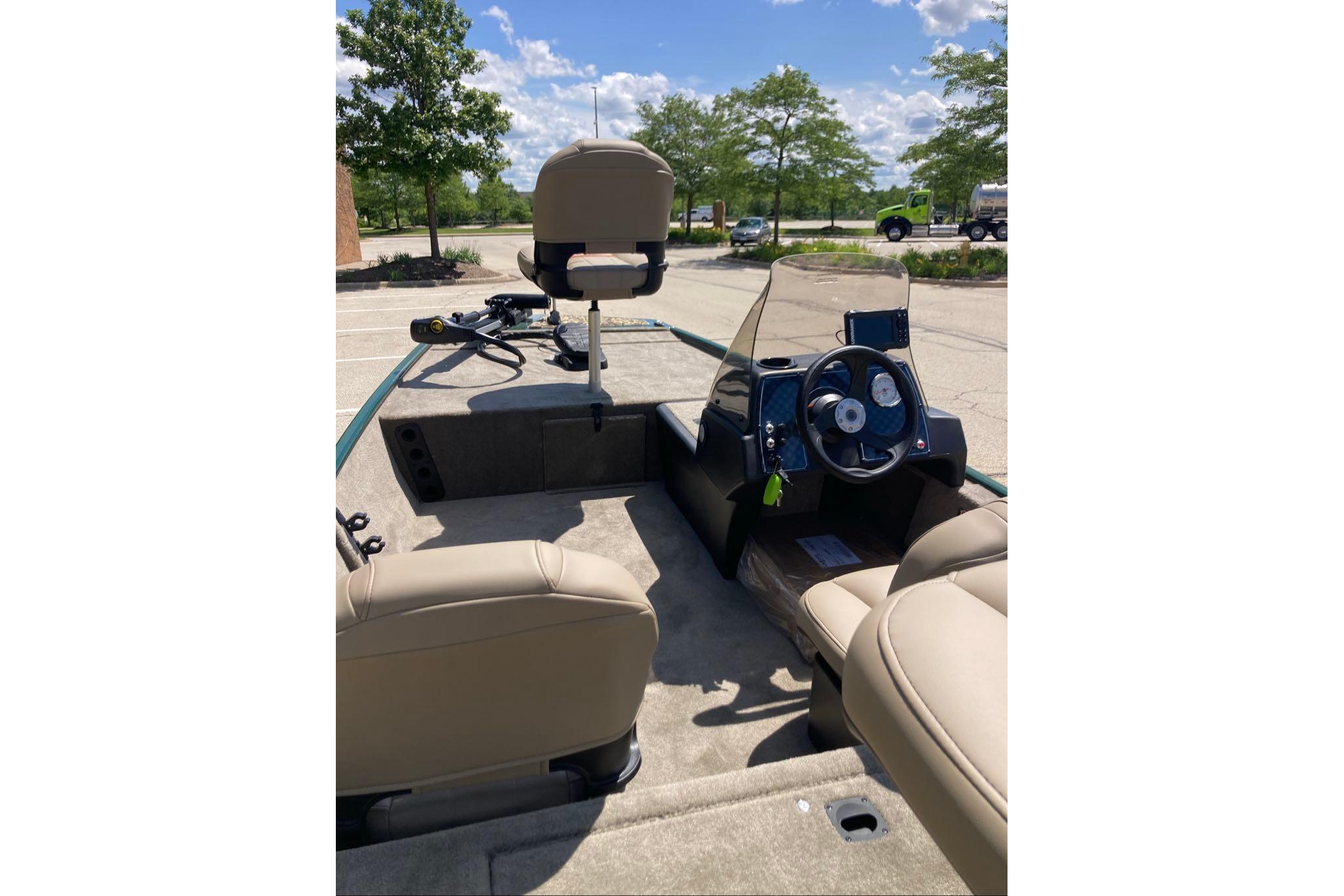 2026 Tracker Bass Tracker Classic Limited boat interior with steering wheel and seating.