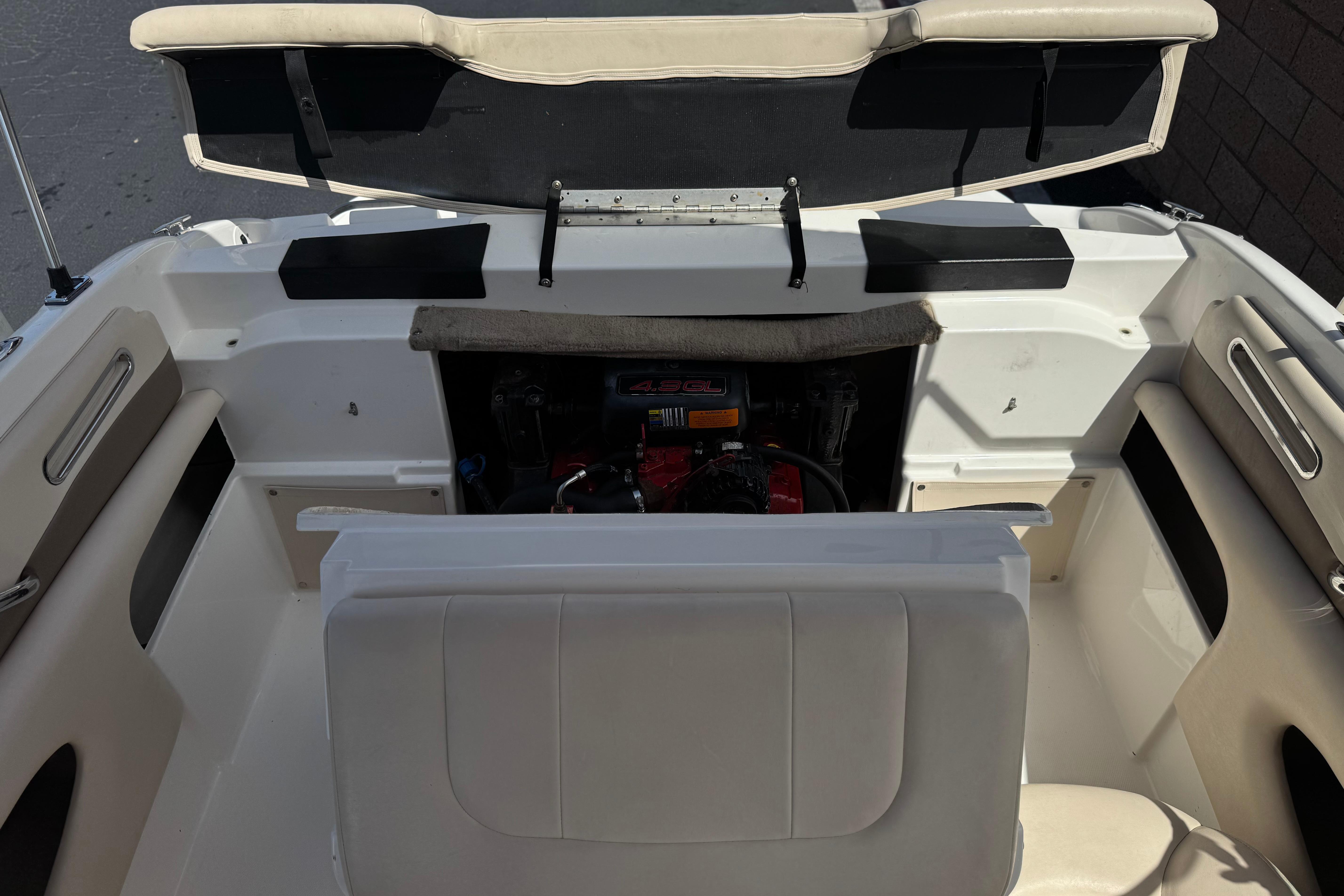 2006 Chaparral 190 SSi boat interior with open engine compartment.