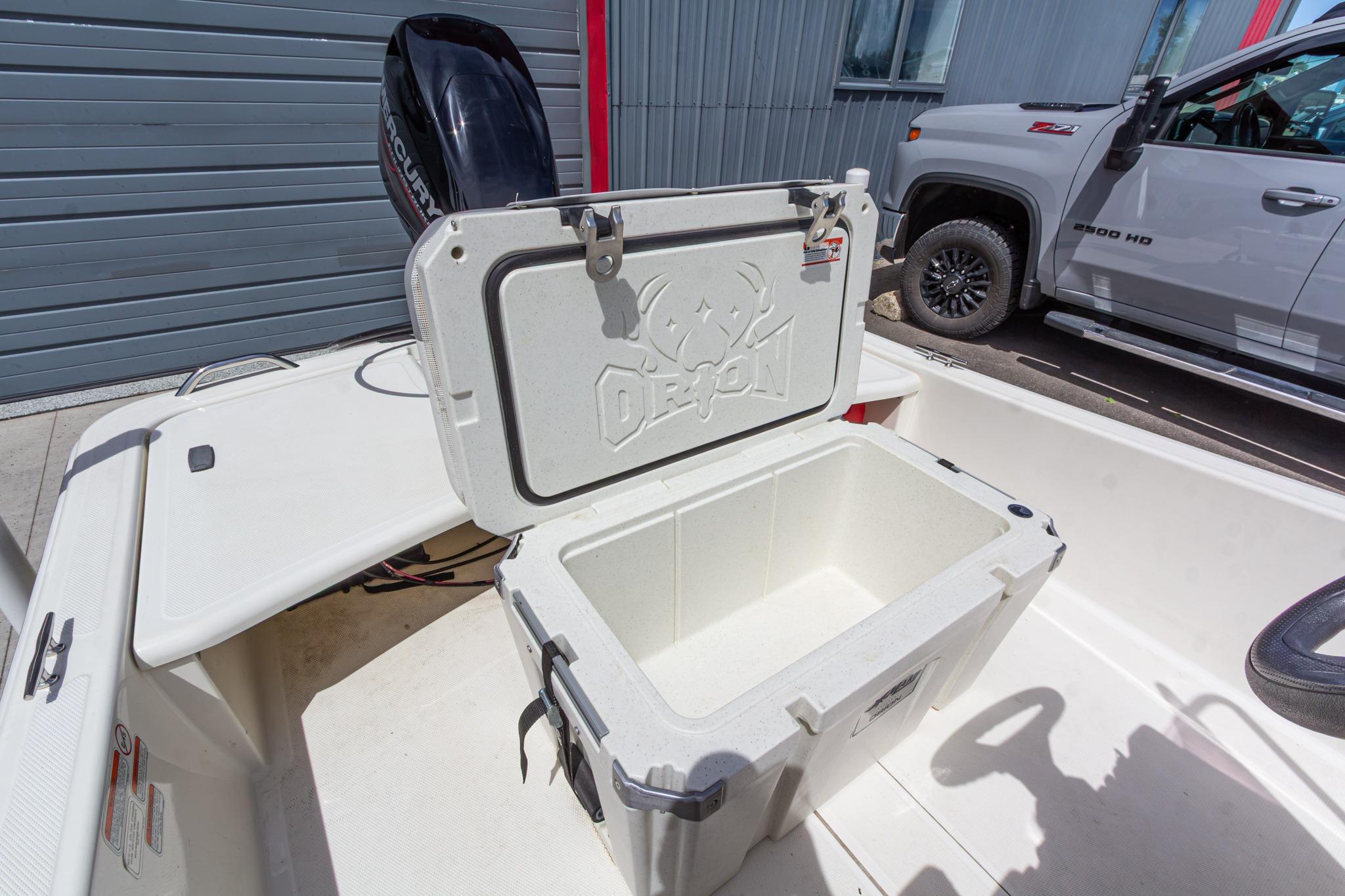 Open cooler on 2020 Mako Pro Skiff 15 CC boat, parked beside a truck.