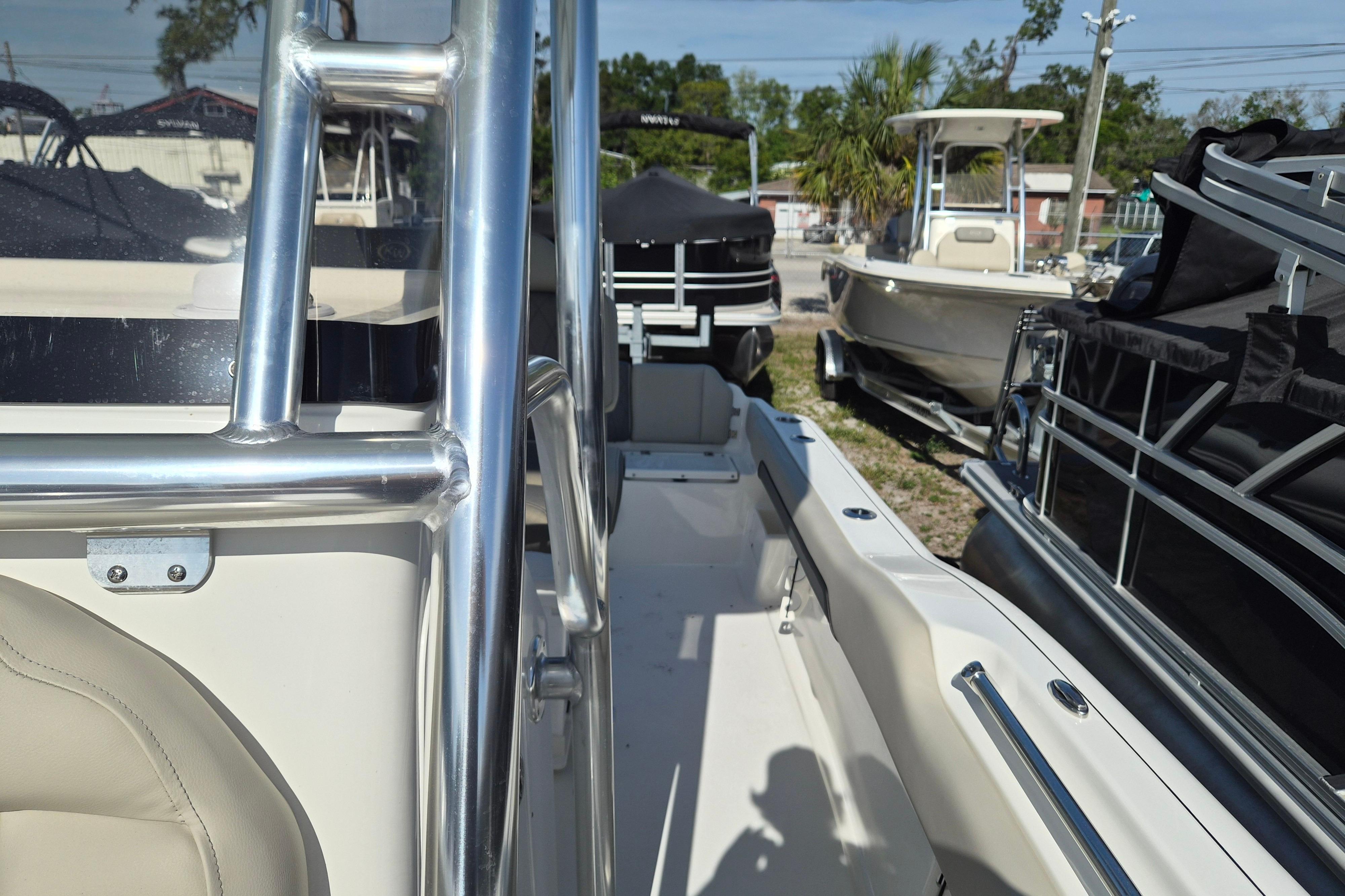 2026 Key West 239 FS boat interior with stainless steel railing and seating.