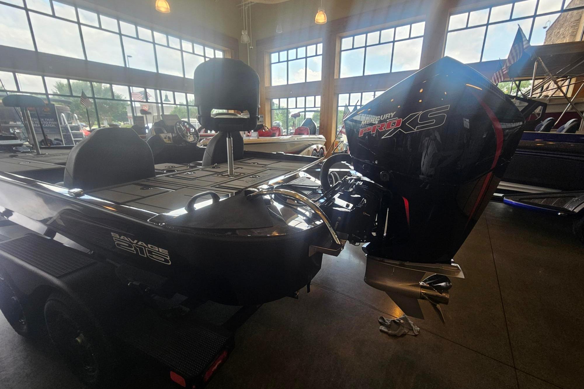 2026 Tracker Savage 215 boat with Mercury Pro XS engine in showroom.