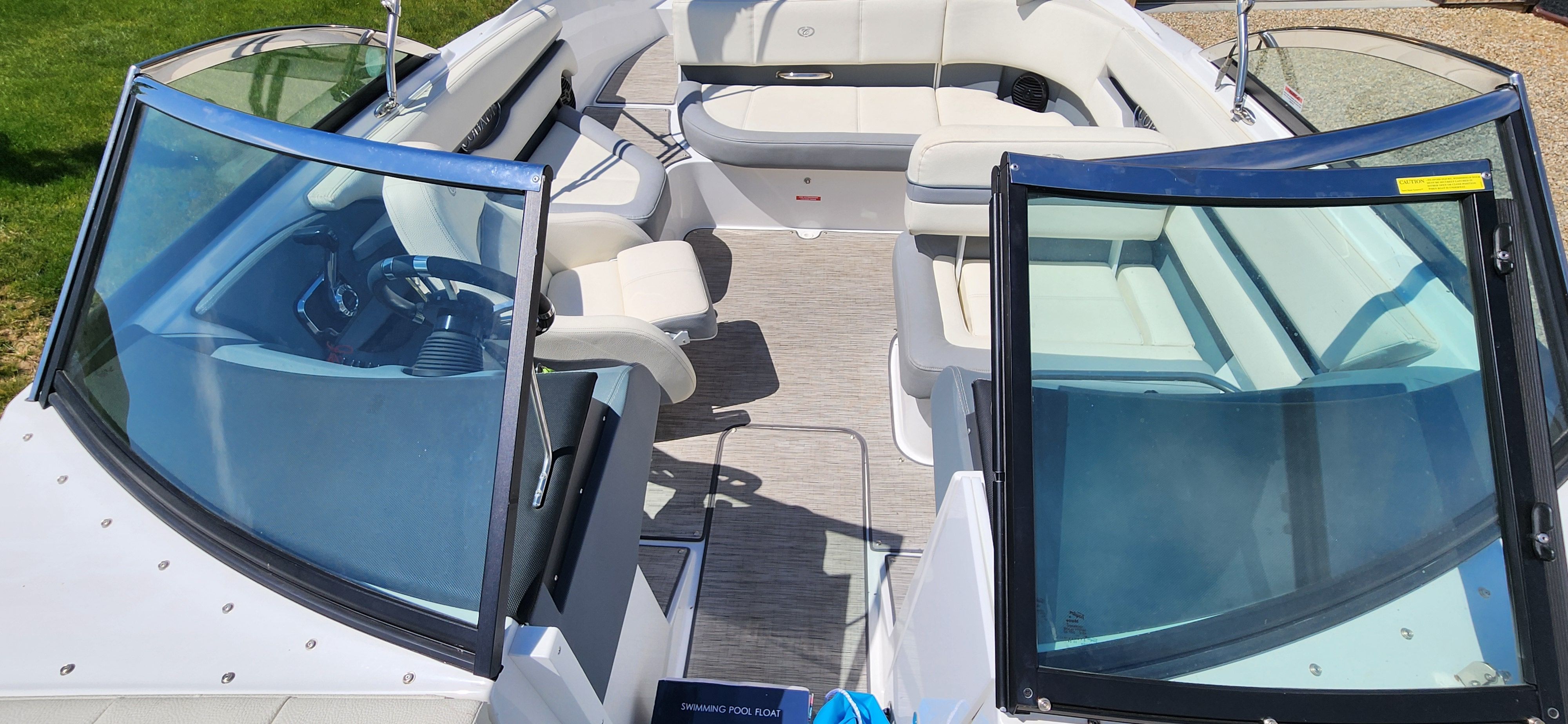 The image shows the interior of a Cobalt CS22 boat with white seats and blue accents.