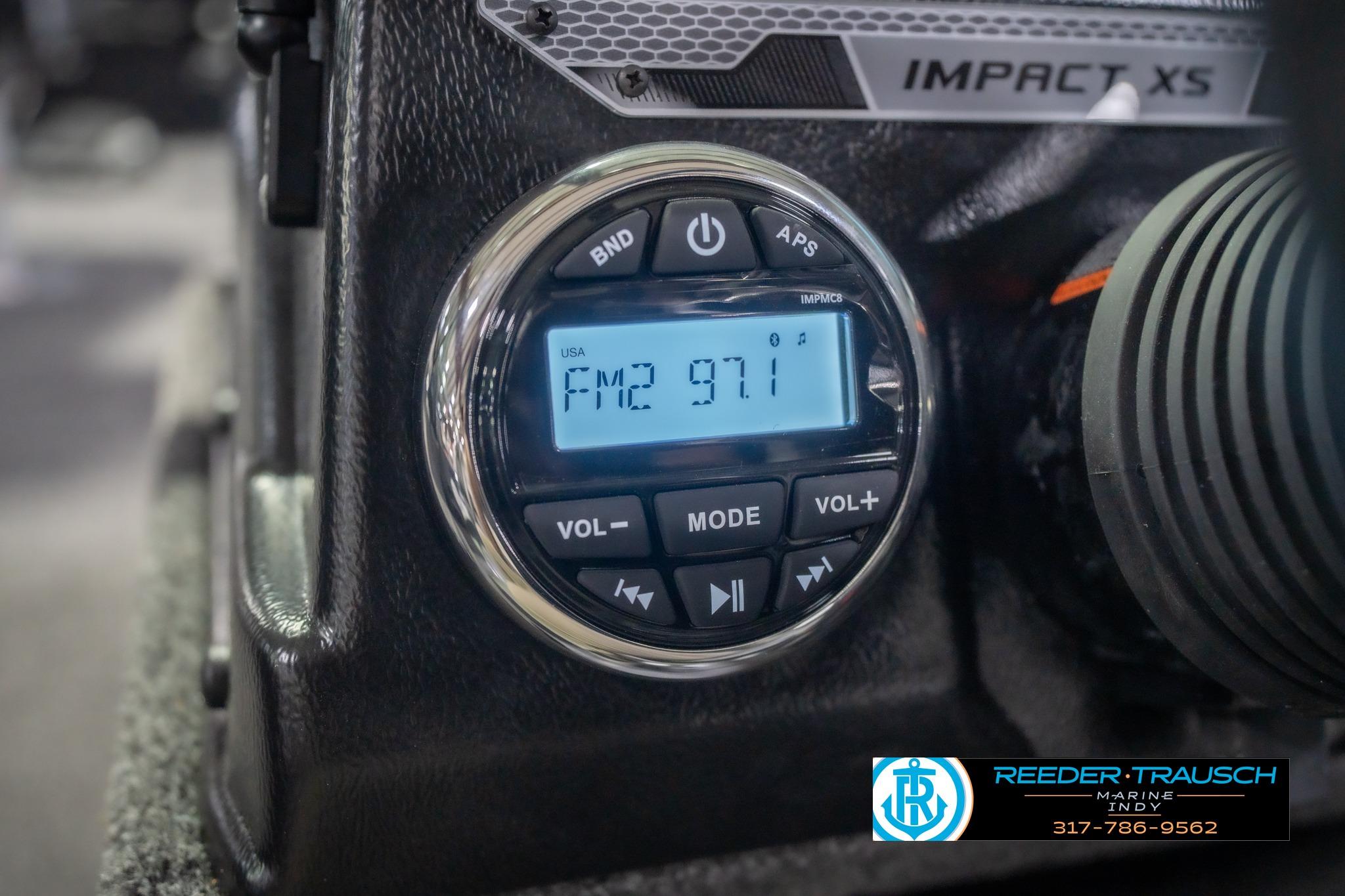 2026 Lund 2075 Impact XS boat radio display showing FM2 97.1 station.