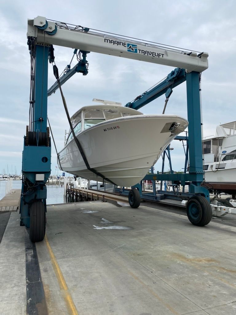 2023 Cobia 330 boat on a Marine Travelift.