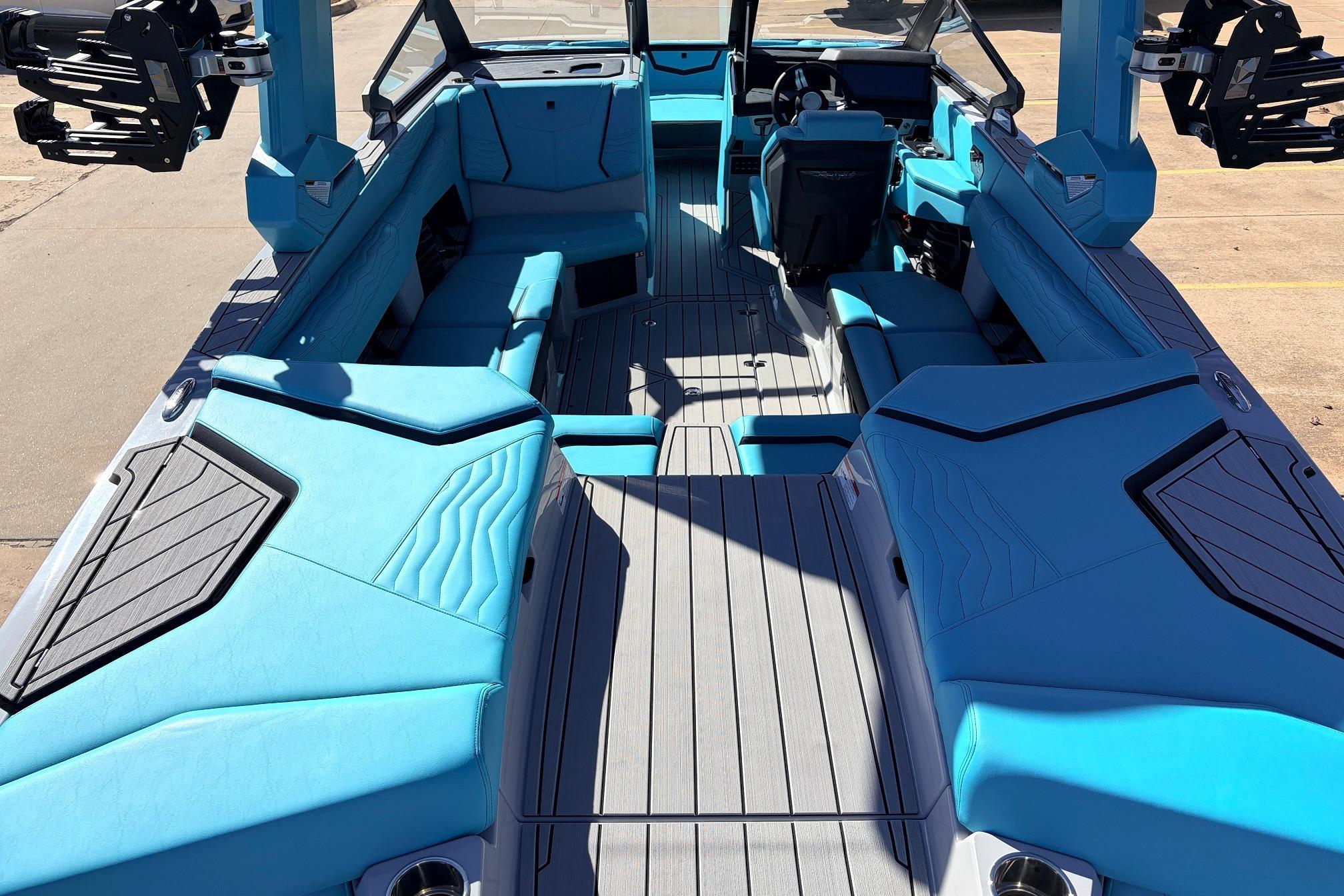 2026 Nautique Super Air Nautique G23 boat interior with blue seating and modern design.