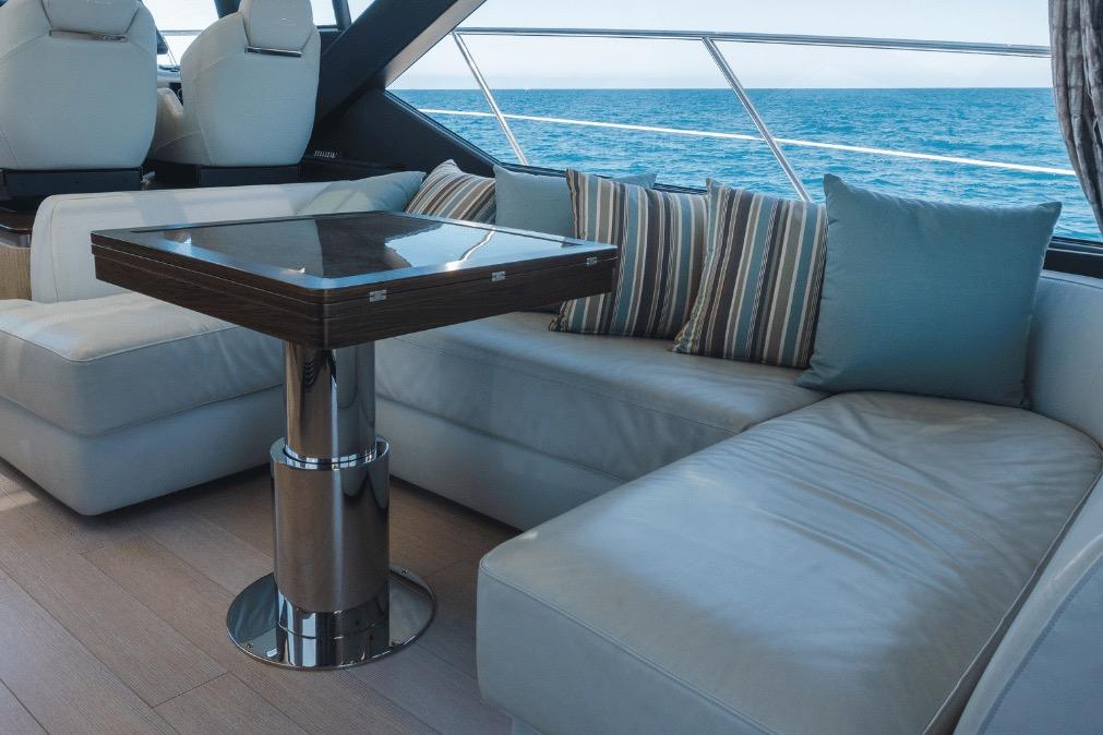 Luxurious interior of 2020 Azimut 60 yacht with elegant seating and ocean view.
