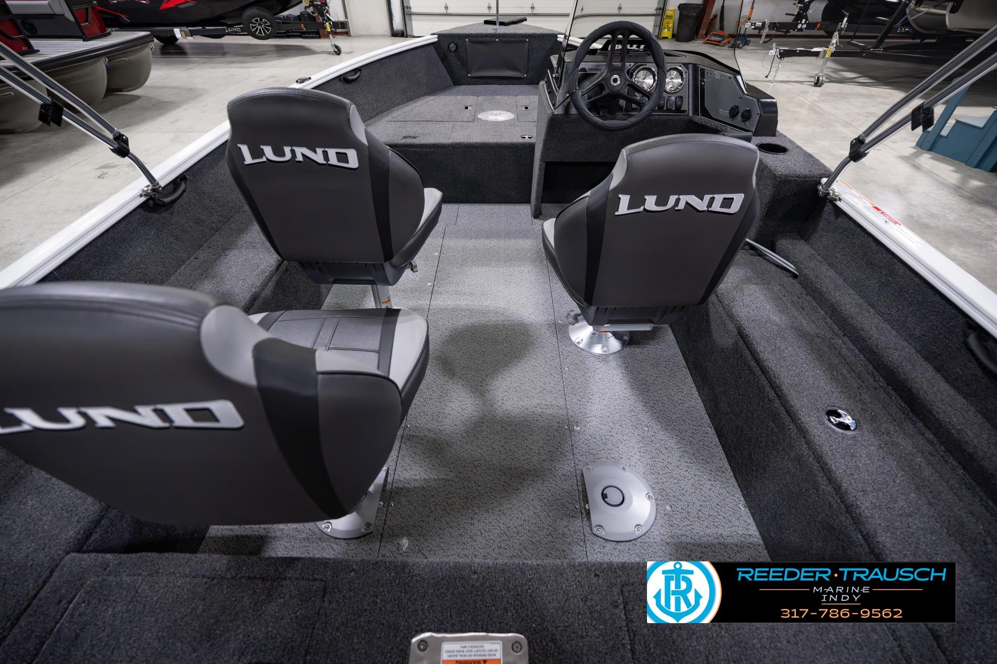 2026 Lund 1650 Rebel XL SS boat interior with branded seats and steering console.