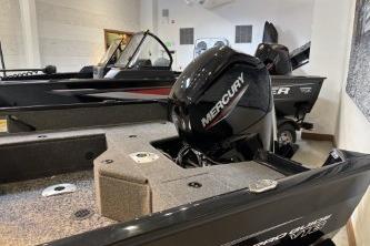 2026 Tracker Pro Guide V-16 WT boat with Mercury engine in showroom.