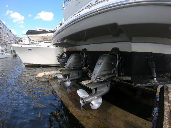2017 Jeanneau NC 11 boat with dual outboard motors docked.