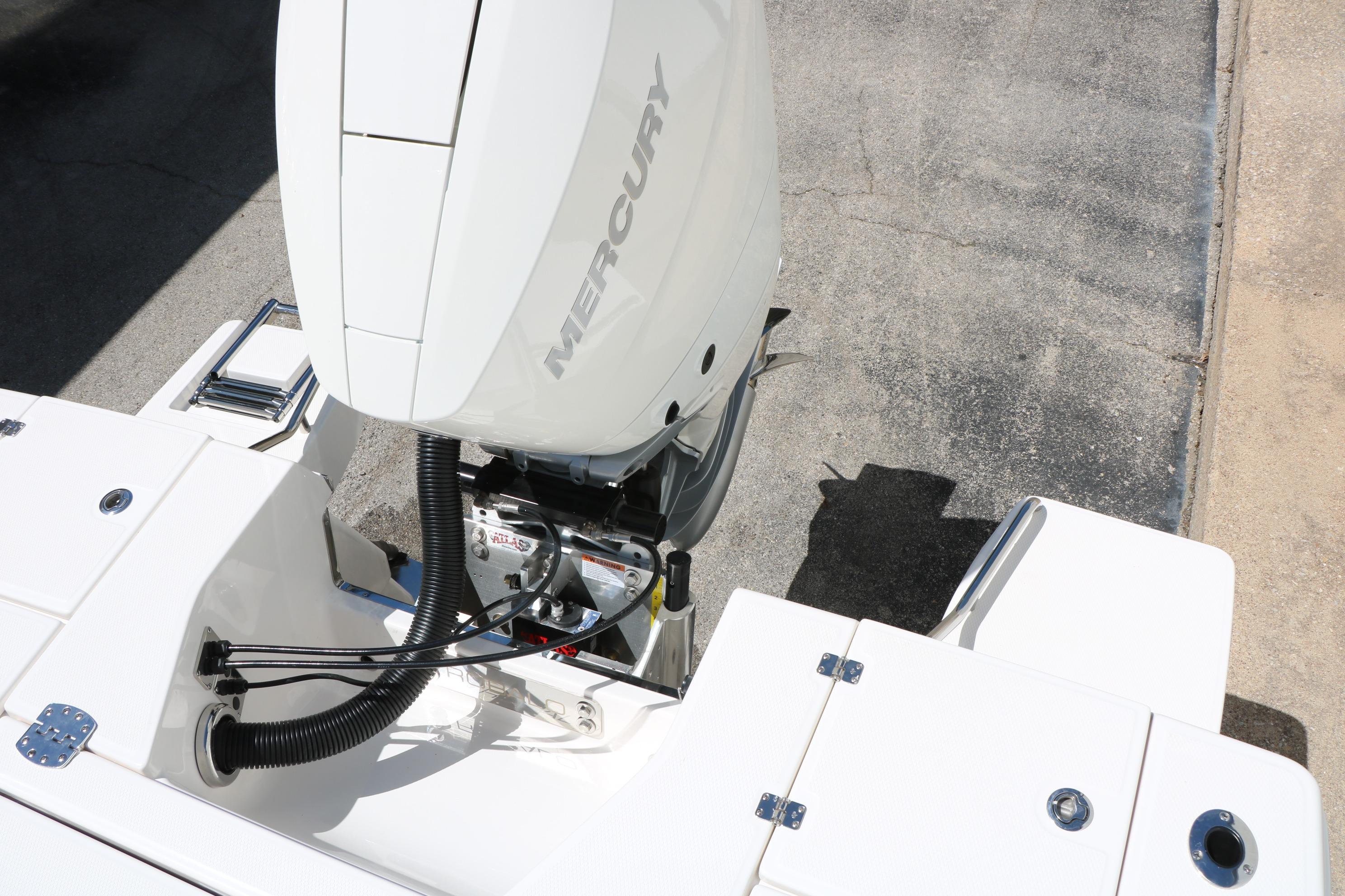 2026 Robalo 246 Cayman boat with Mercury outboard engine, rear deck view.
