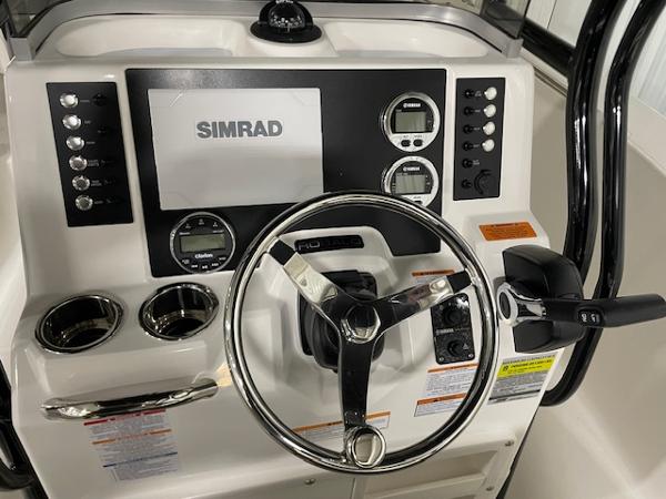 2025 Robalo R202 Explorer dashboard with Simrad display and controls.