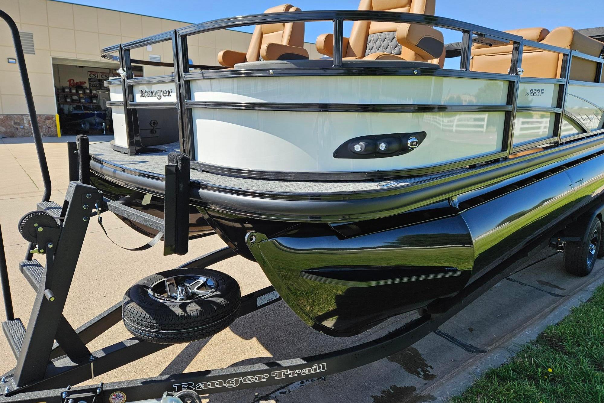 2026 Ranger 223F boat on trailer, featuring sleek design and comfortable seating.