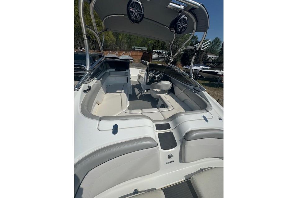 2012 Yamaha AR210 boat interior with seating and speakers, showcasing sleek design.