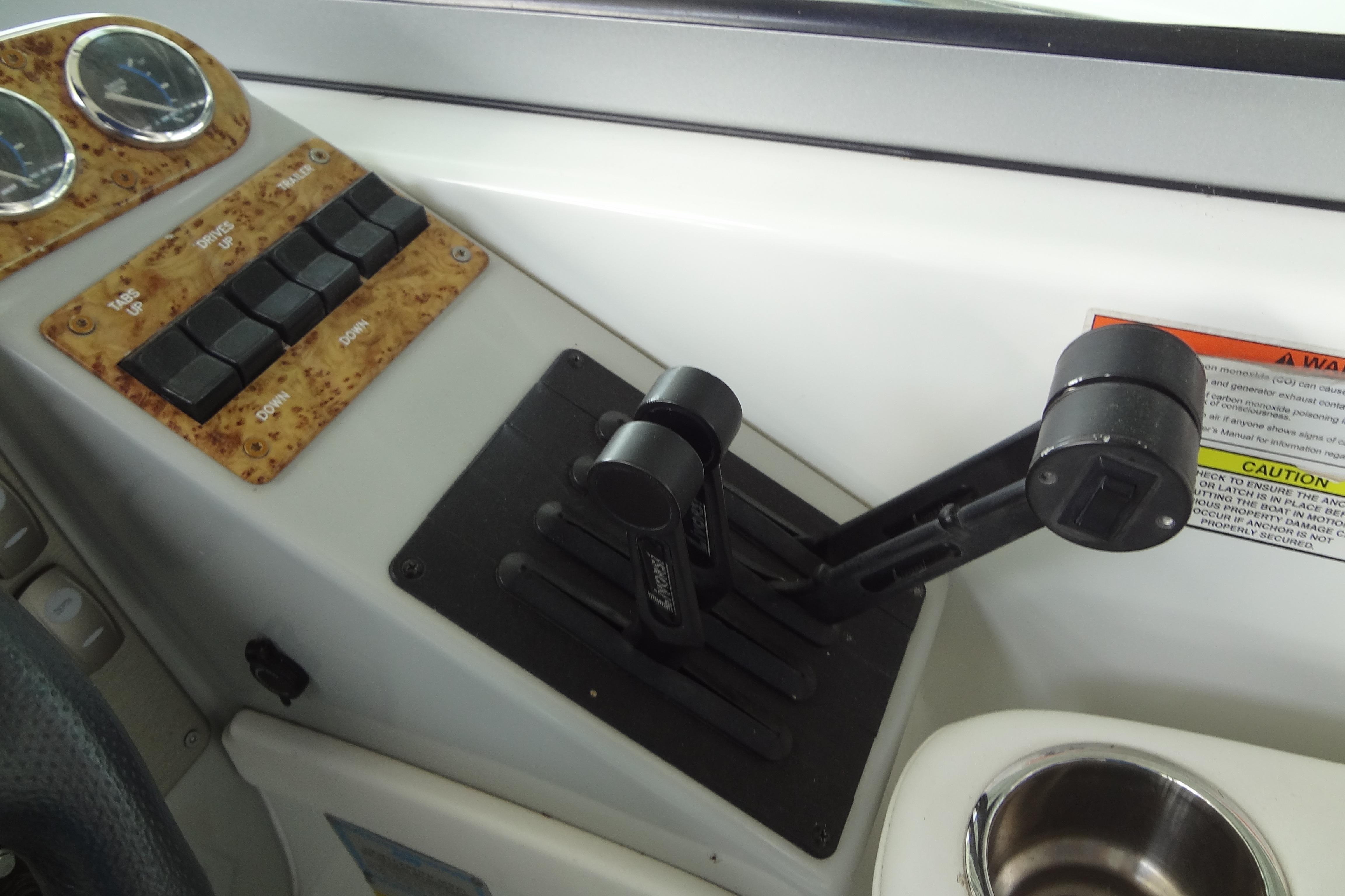 Control panel of a 2007 Formula 34 Performance Cruiser with throttle levers and switches.