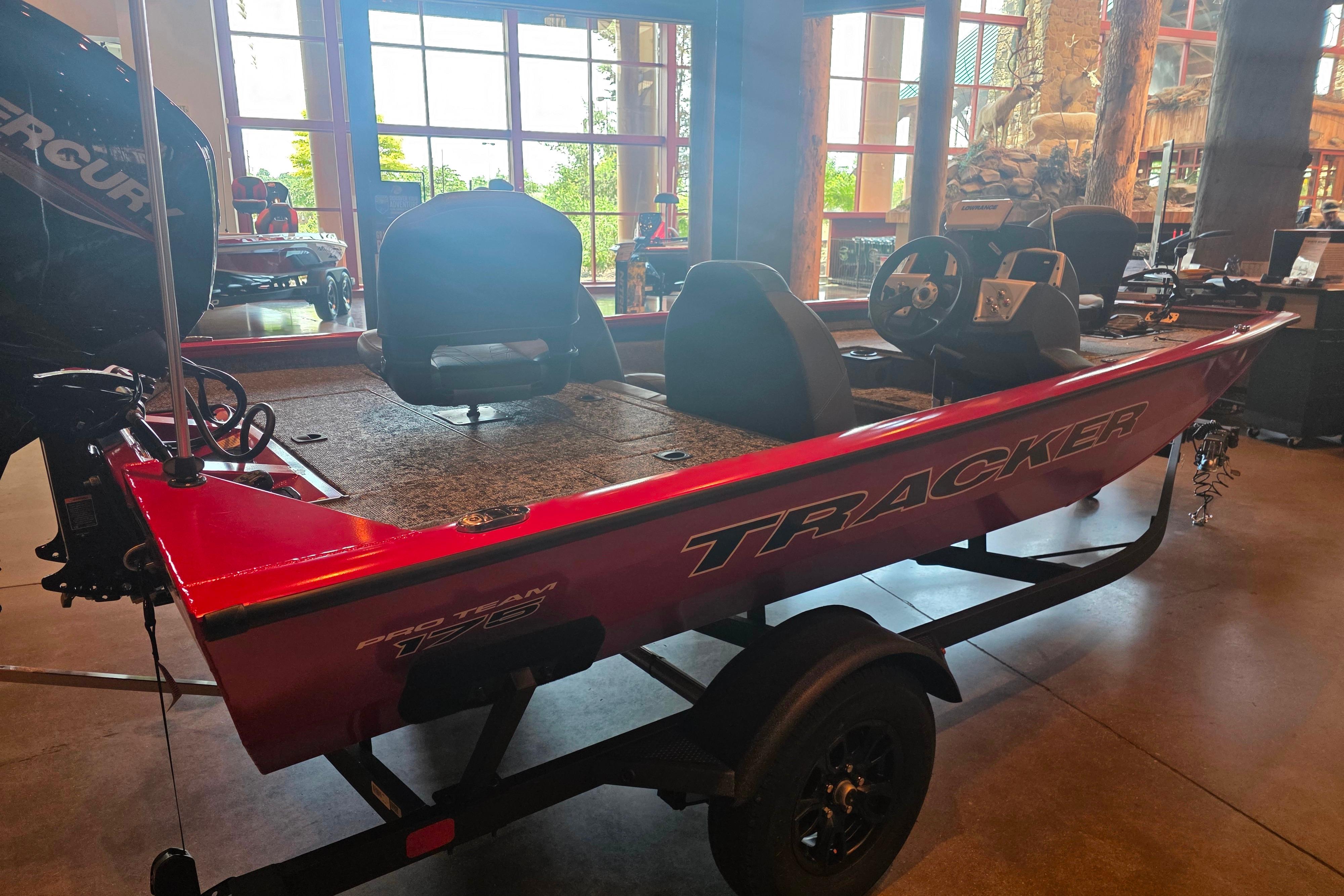 2026 Tracker Pro Team 175 boat displayed indoors with visible seating and controls.