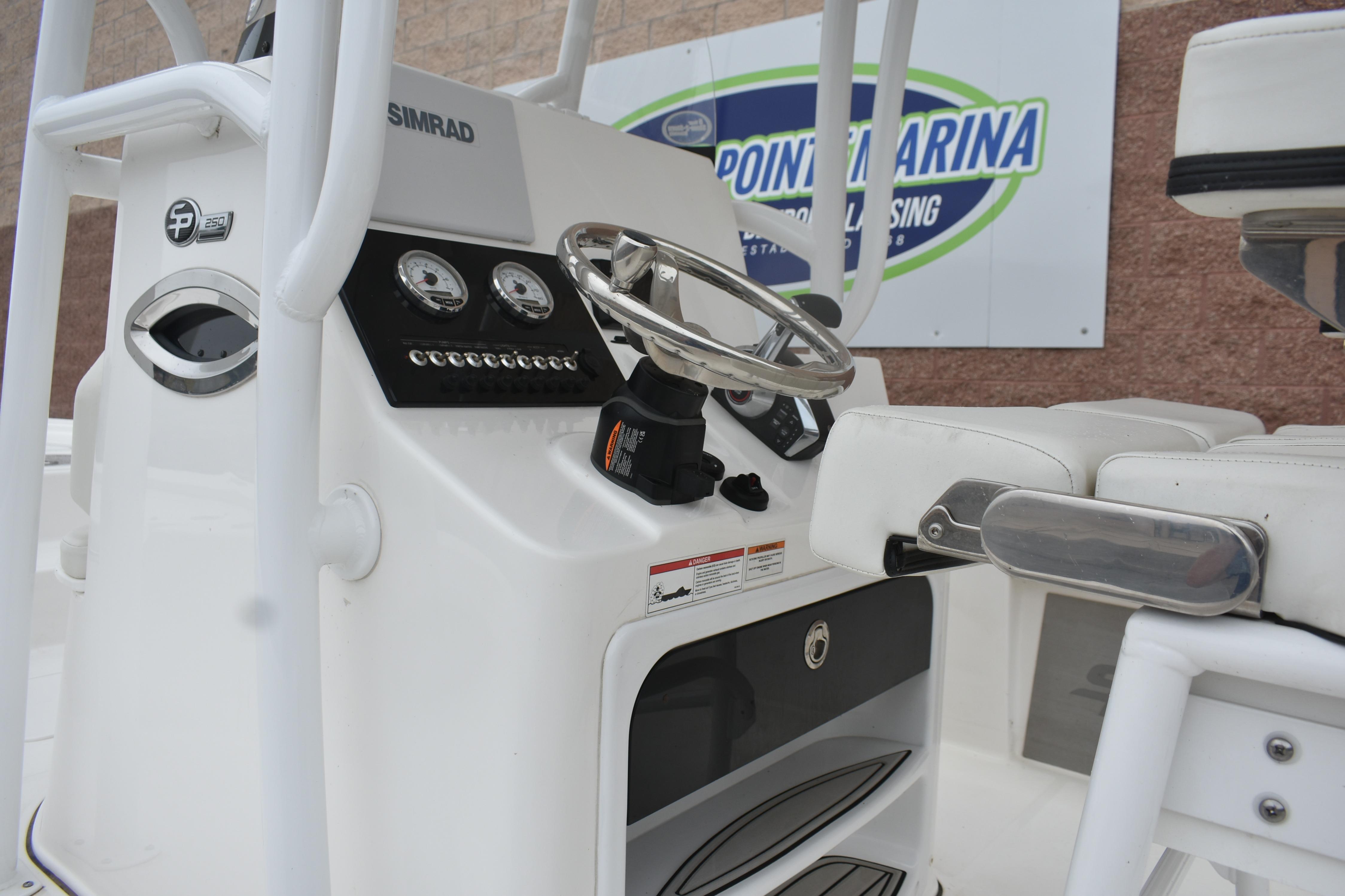 2025 Sea Pro 250 Bay boat console with steering wheel and gauges at Point Marina.