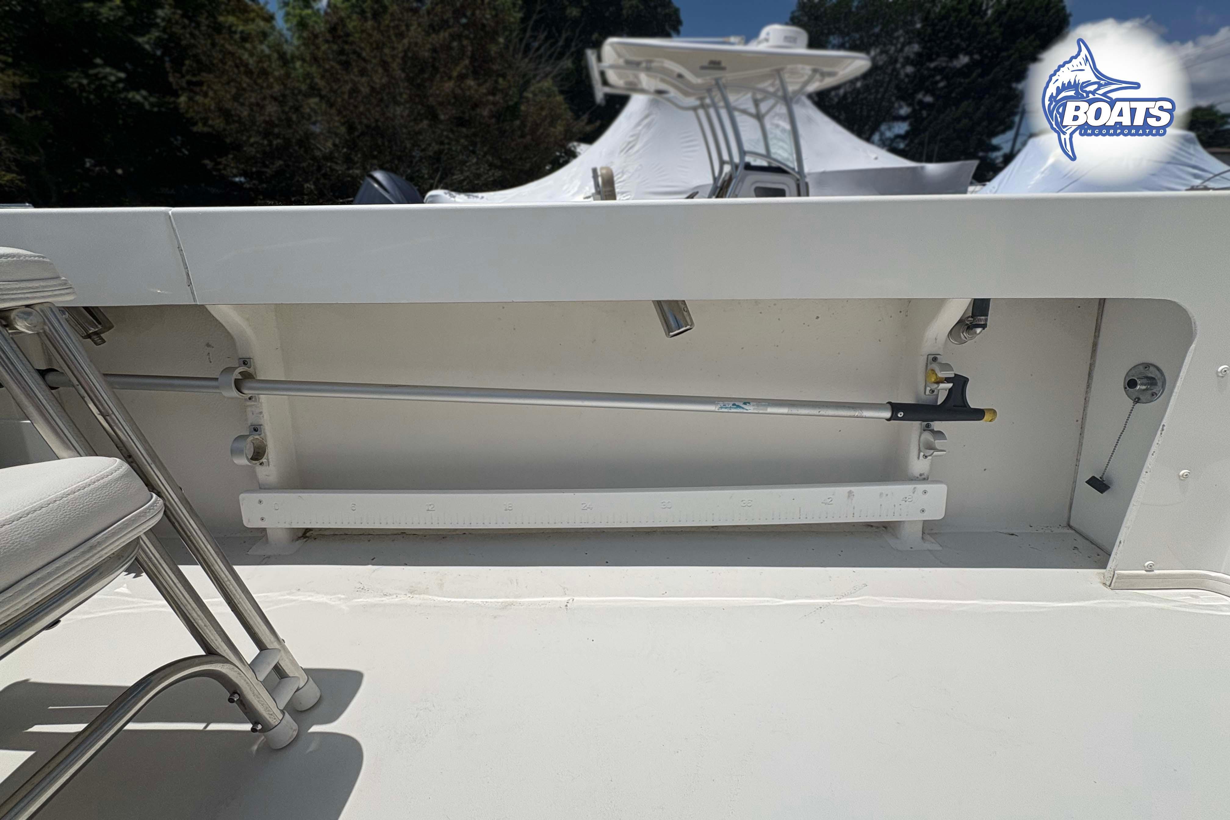 2021 Parker 2520 XLD Sport Cabin boat interior with rod holder and seating.