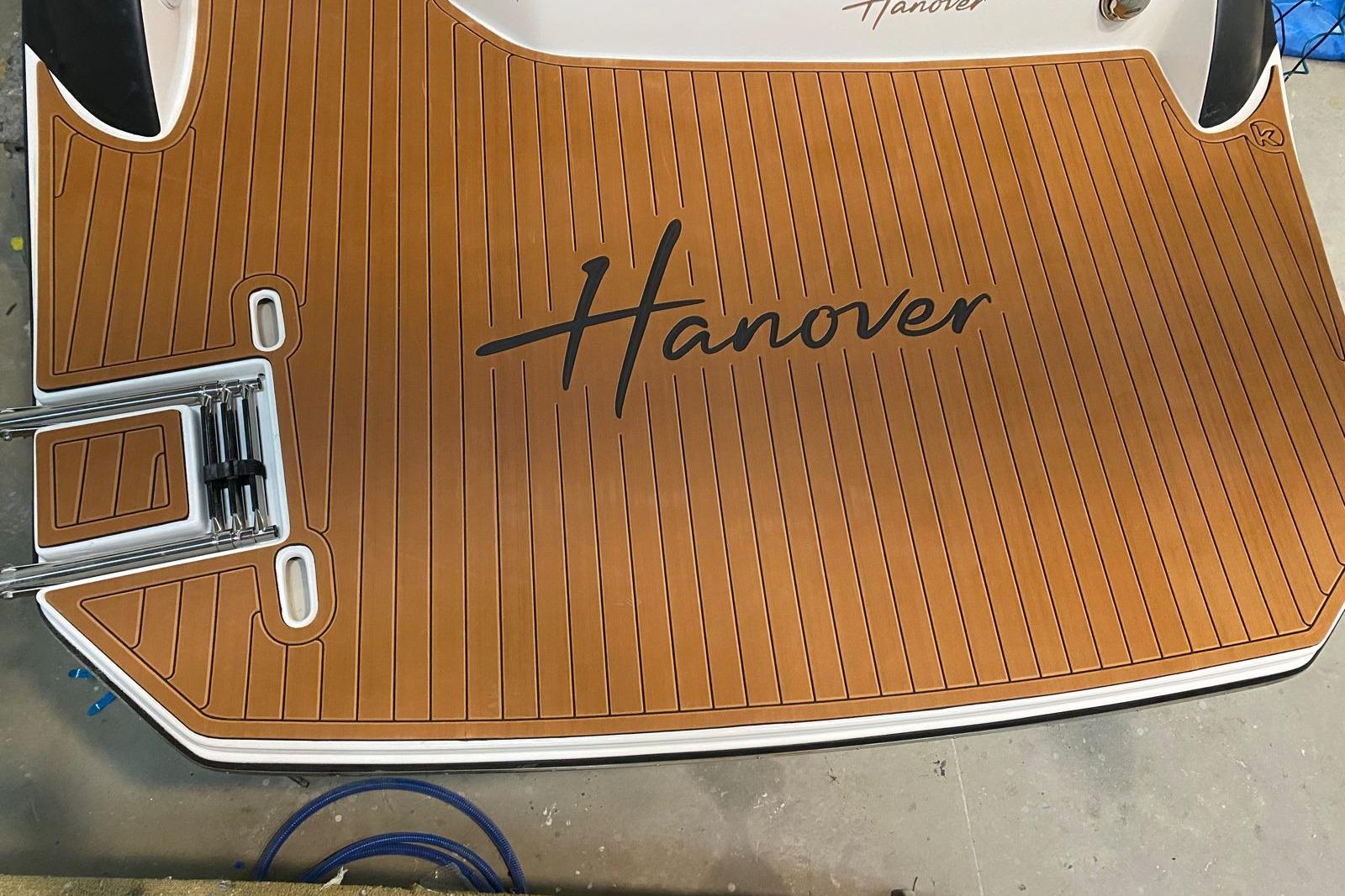 Teak-style boat deck with "Hanover" logo, Hanover 305 model, 2026.