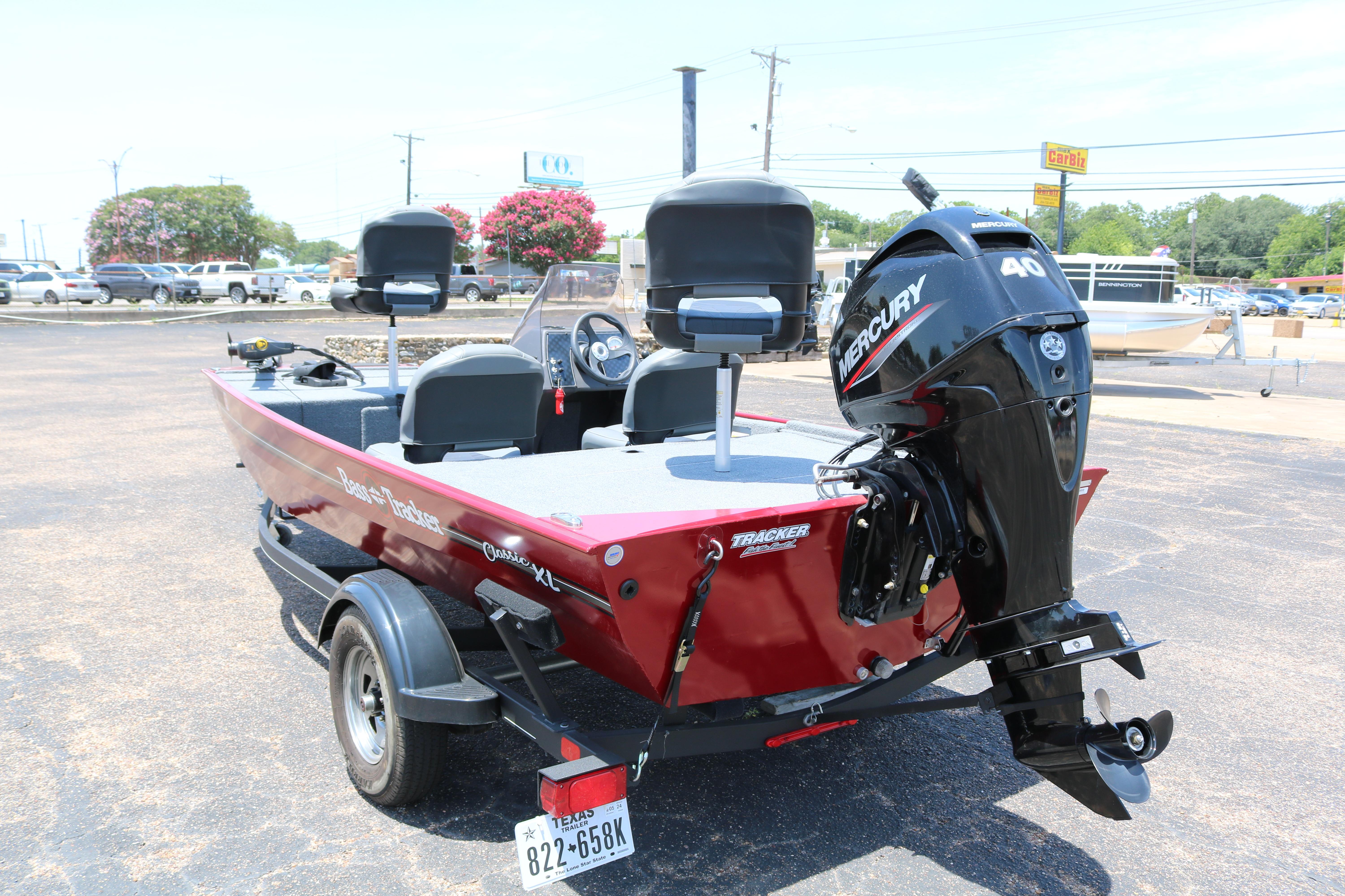 2021 Tracker Bass Tracker Classic XL boat with Mercury engine in parking lot.