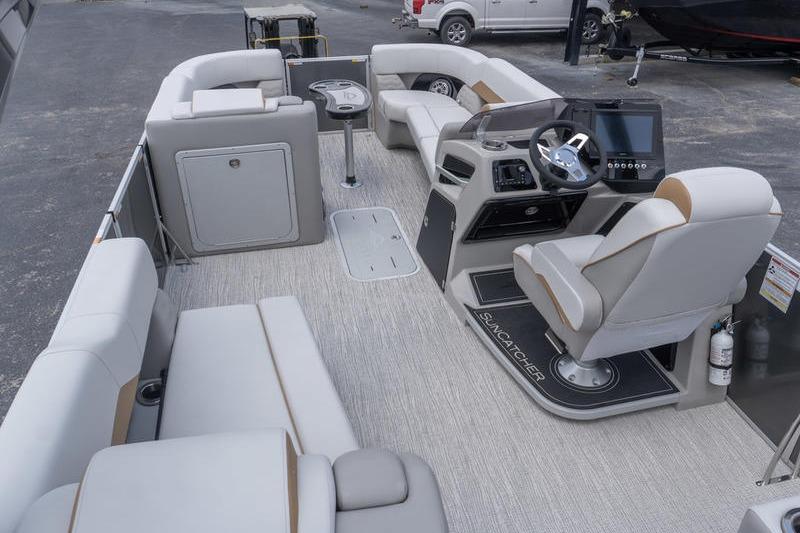 Interior of 2026 SunCatcher Elite 326 SS pontoon boat with luxurious seating and modern helm.