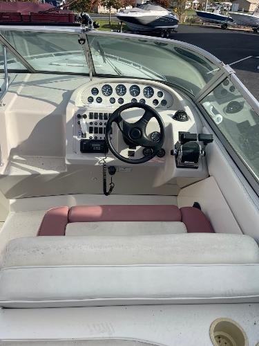 1992 Regal Ventura boat cockpit with steering wheel and control panel.