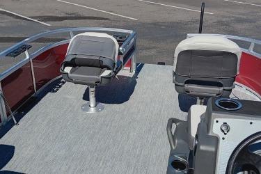 2026 Sun Tracker Bass Buggy 16 XL Select pontoon boat with seating and control console.