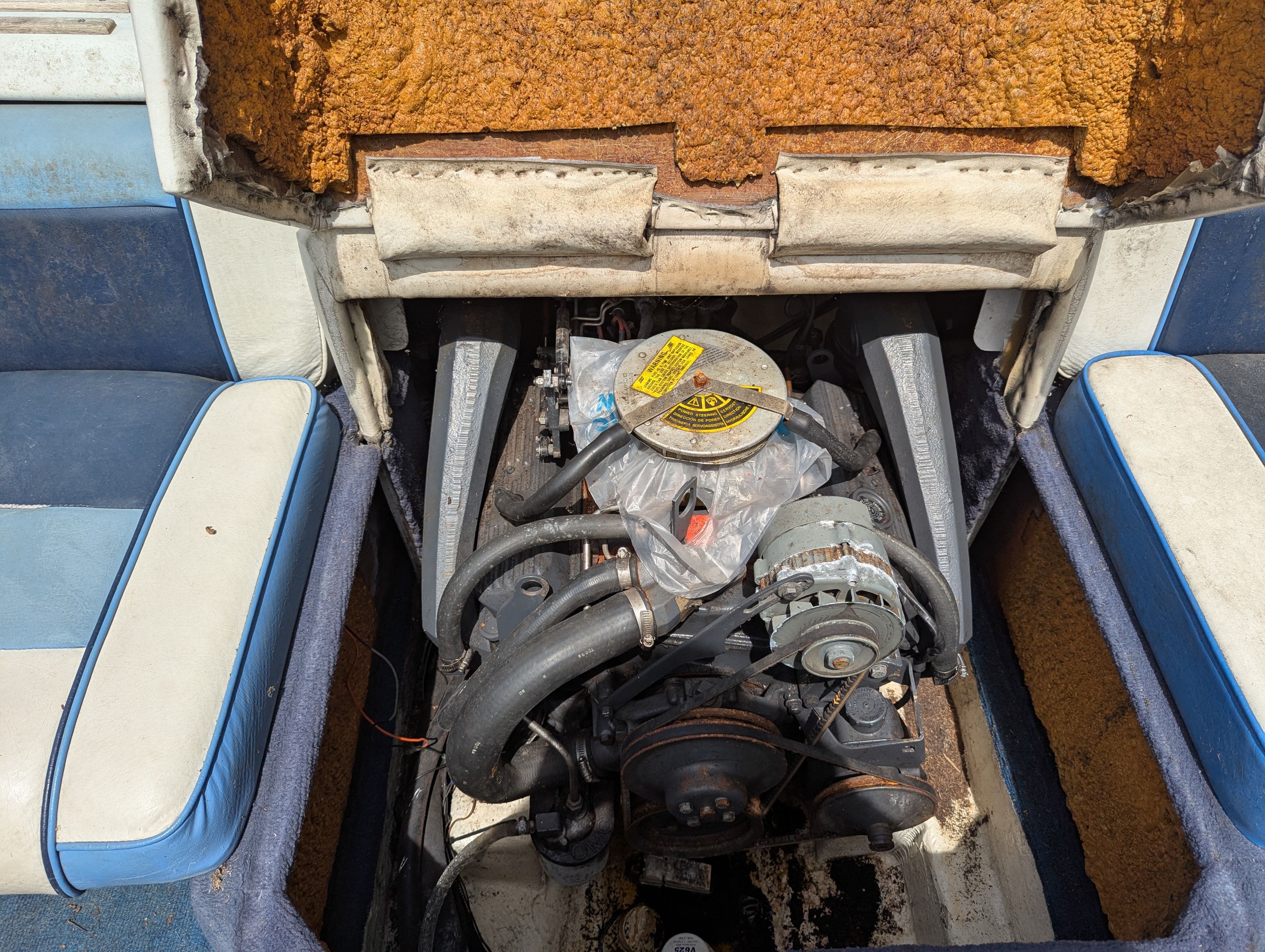 Engine compartment of a 1988 Four Winns 200 Horizon boat.