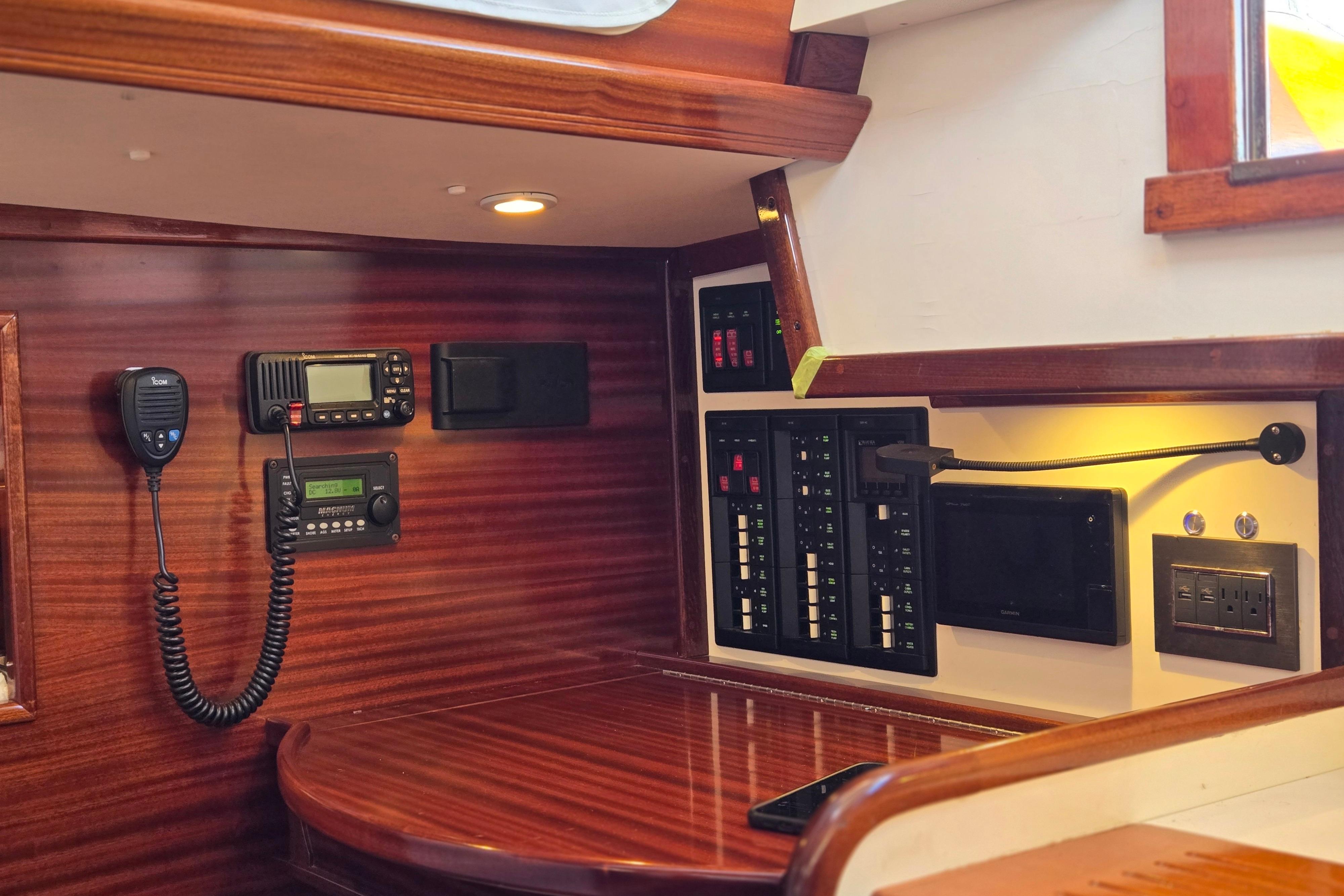 Interior of a 1970 Hinckley Bermuda 40 sailboat with navigation and communication equipment.