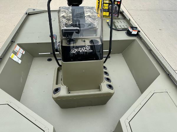 2025 Tracker Grizzly 2072 CC Sportsman boat interior with console and storage compartments.