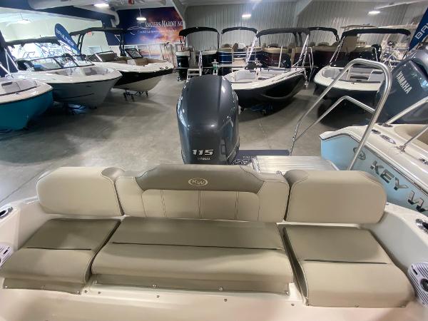 2024 Key West 189 FS boat interior with Yamaha 115 engine in showroom.