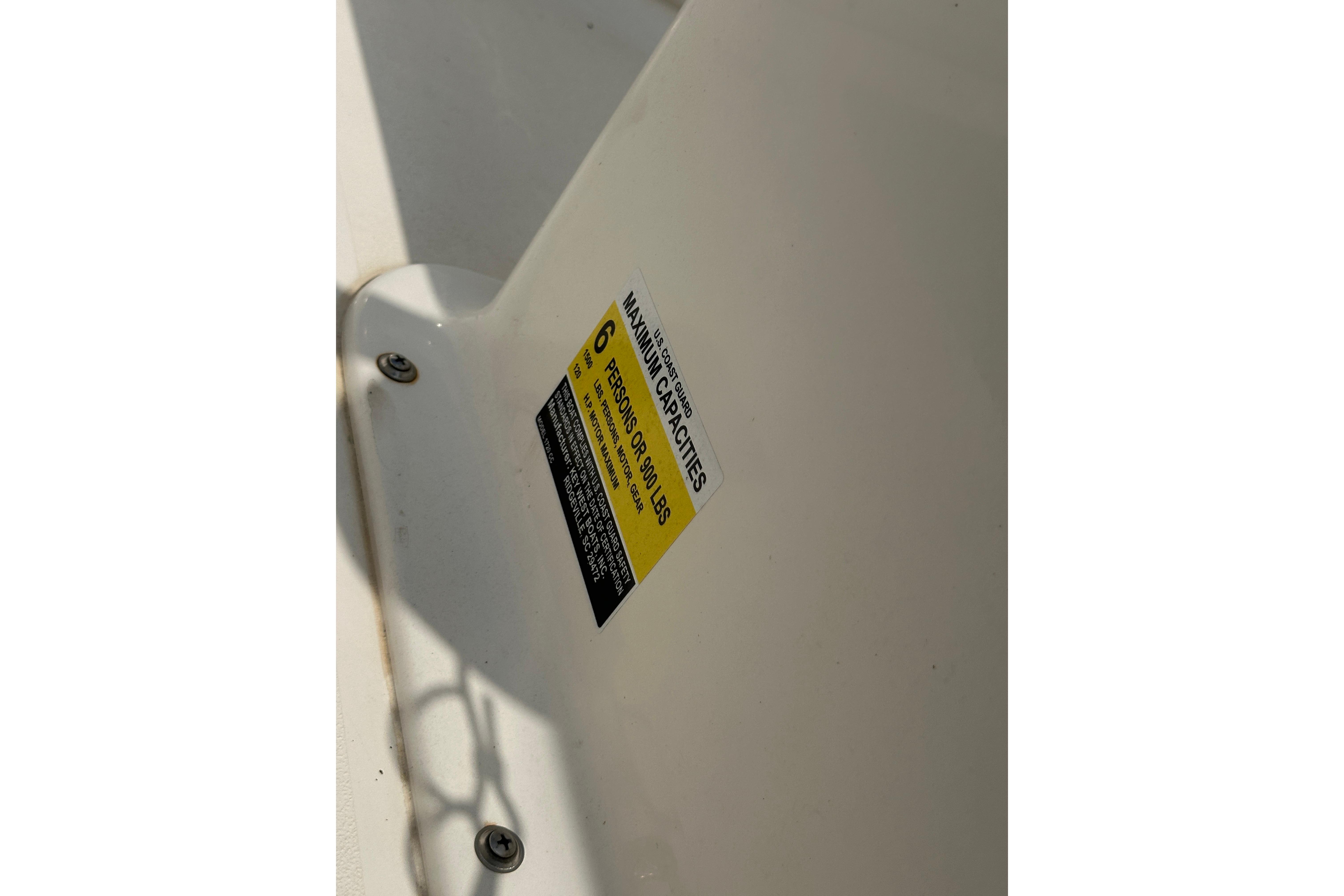 2018 Key West 1720 Center Console capacity label, showing maximum of 6 persons or 900 lbs.