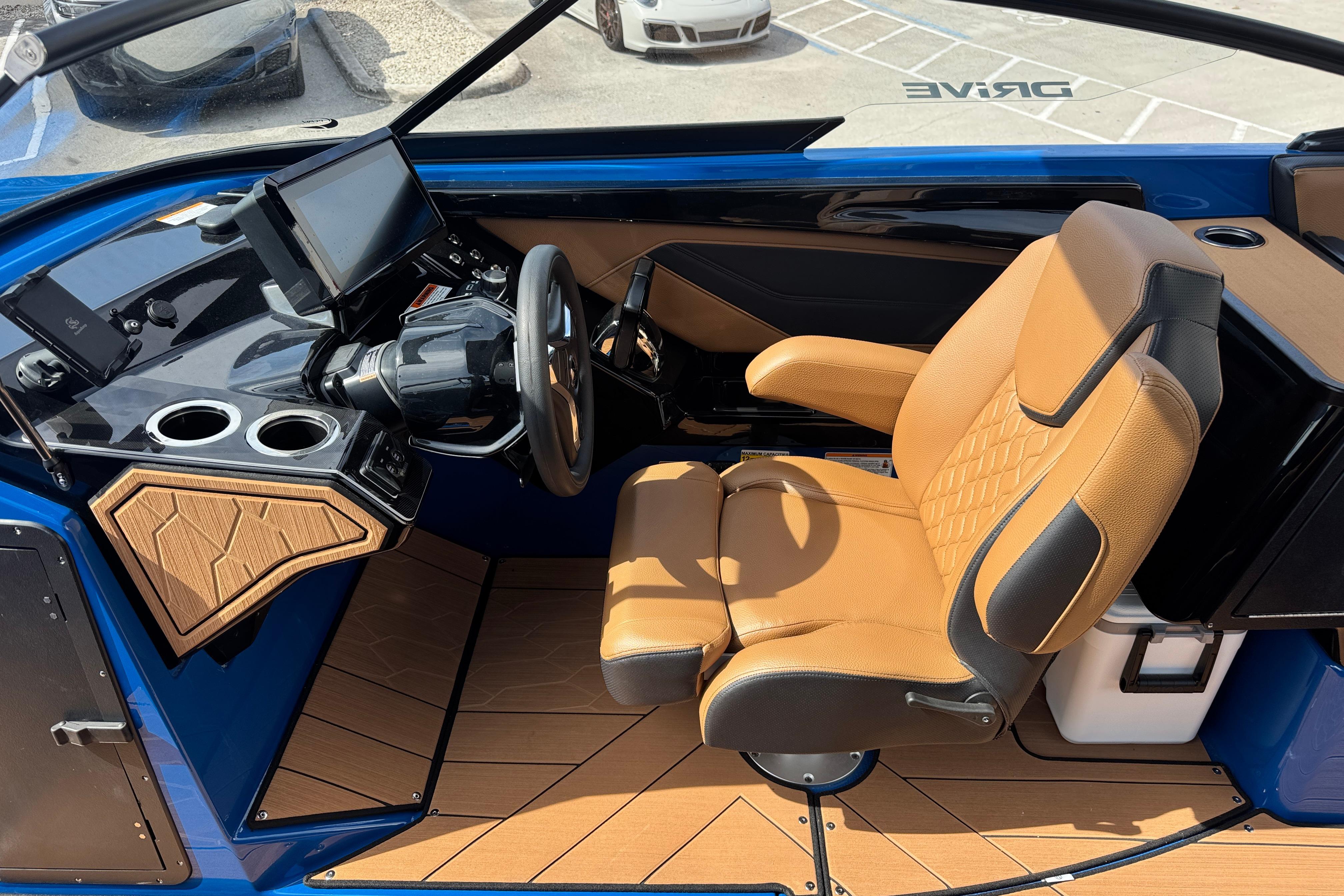 Interior of 2026 Yamaha Boats 255XD, featuring a modern helm and luxurious seating.