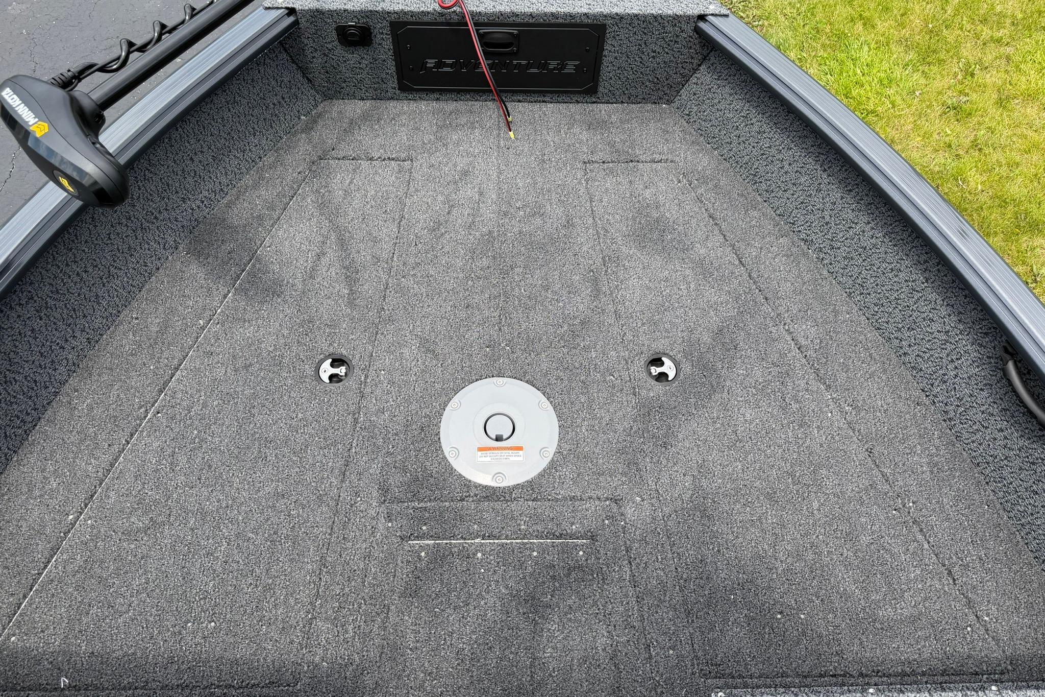 2027 Lund 1675 Adventure Sport boat deck with carpeted surface and fishing rod holder.