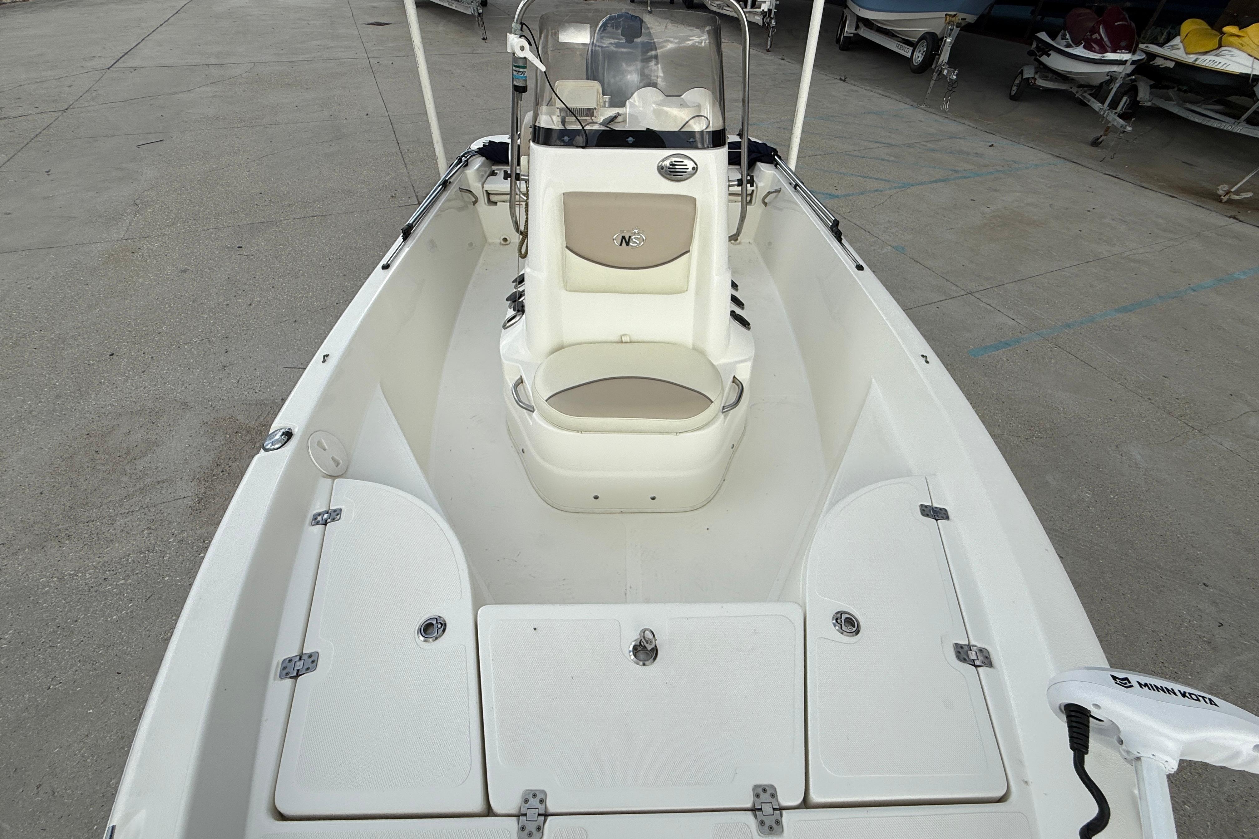 2017 NauticStar 1910 NauticBay boat interior with seating and storage compartments.