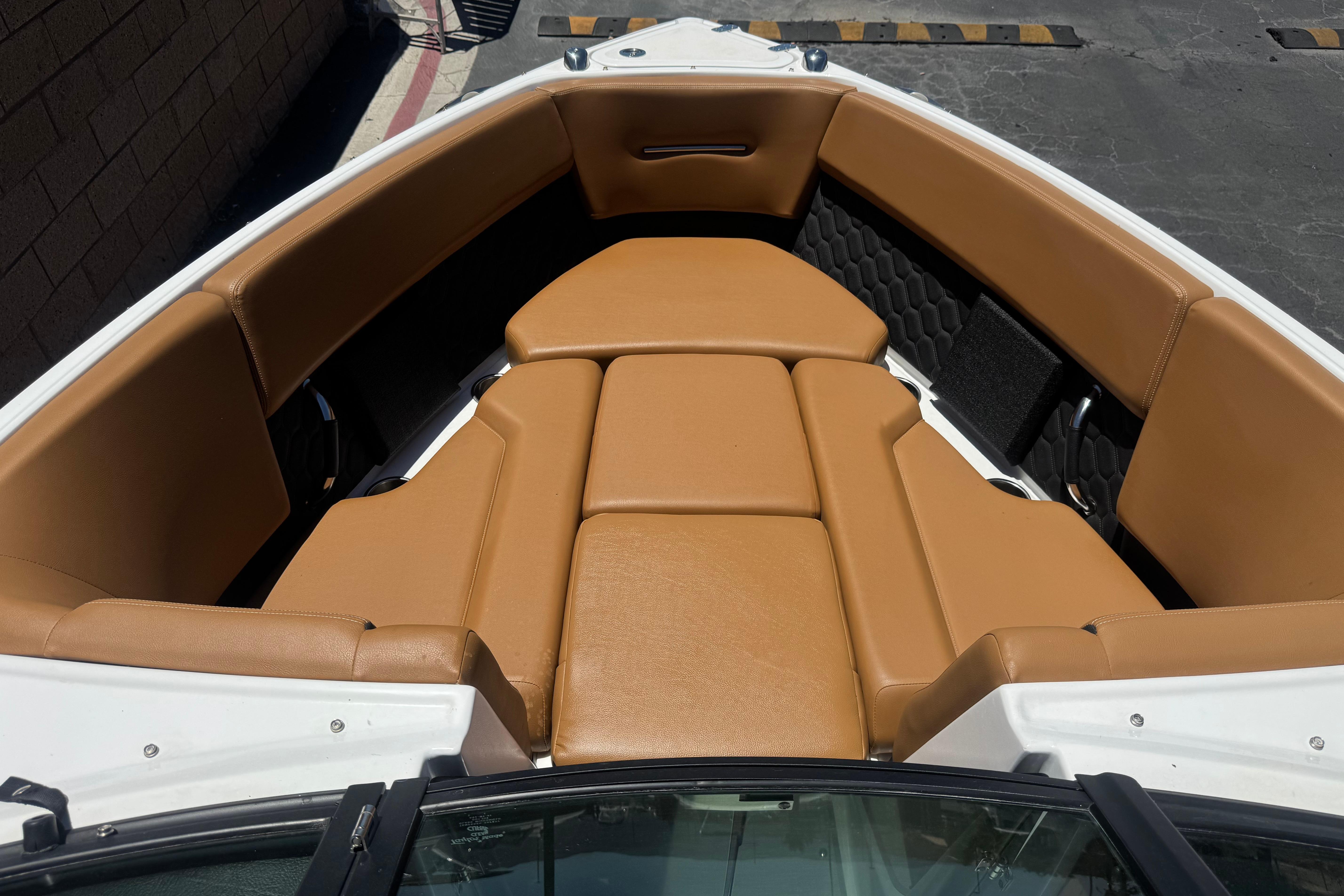 2022 Four Winns H4 boat interior with tan leather seating.