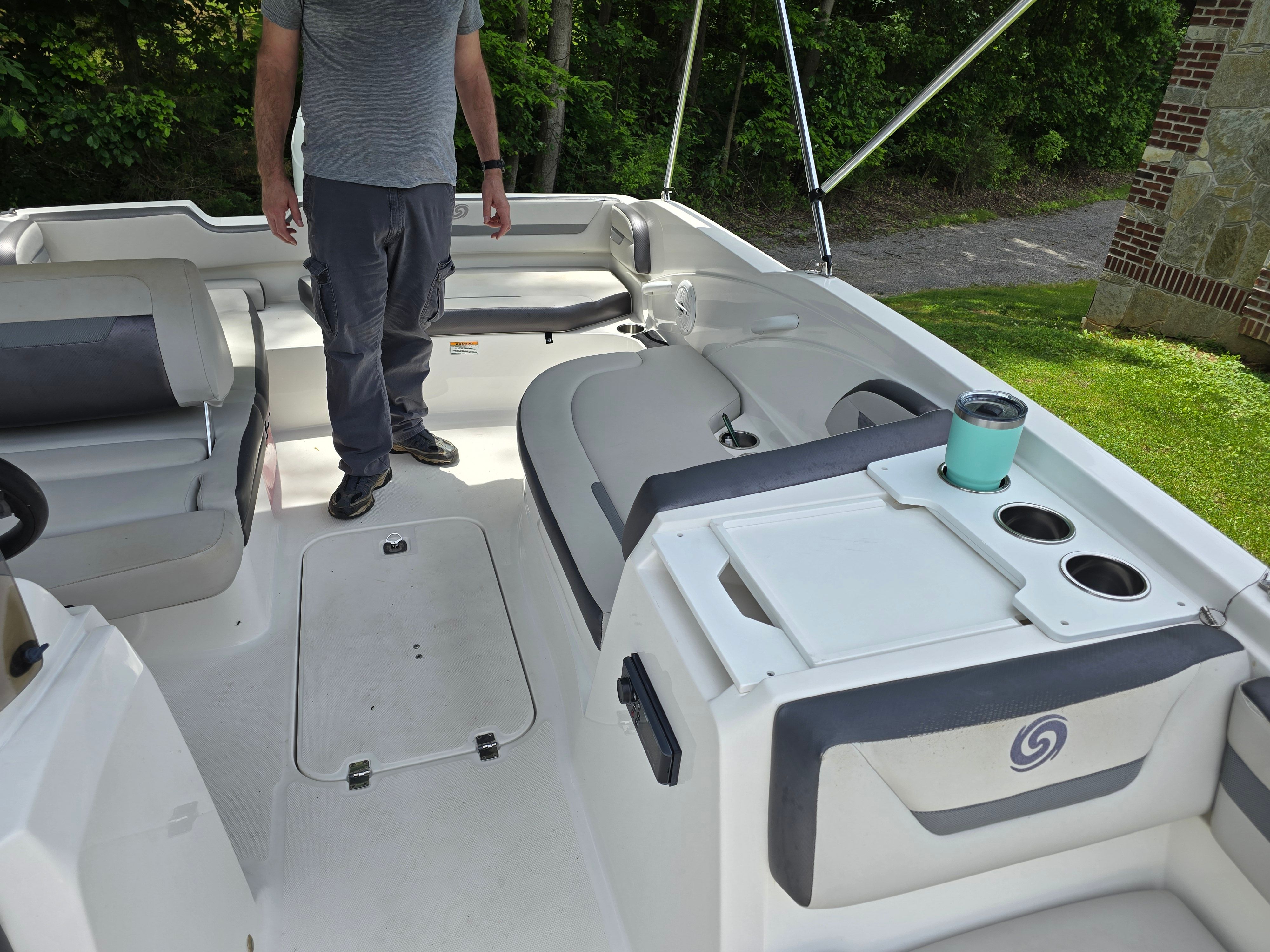 Interior of a 2021 Hurricane 205SS boat with seating and cup holders.