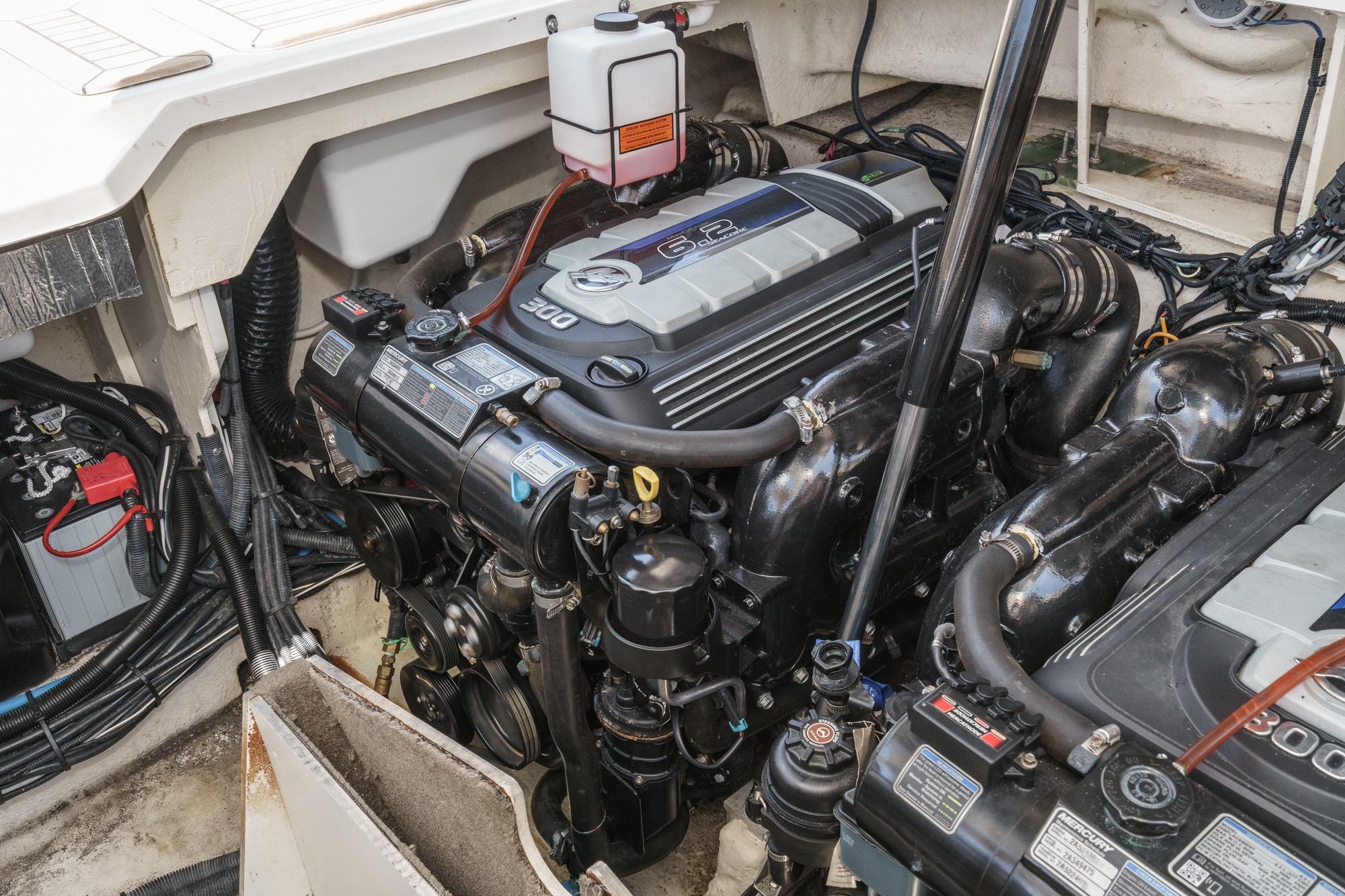 Engine compartment of a 2018 Sea Ray SLX 310 boat, showcasing detailed mechanics.