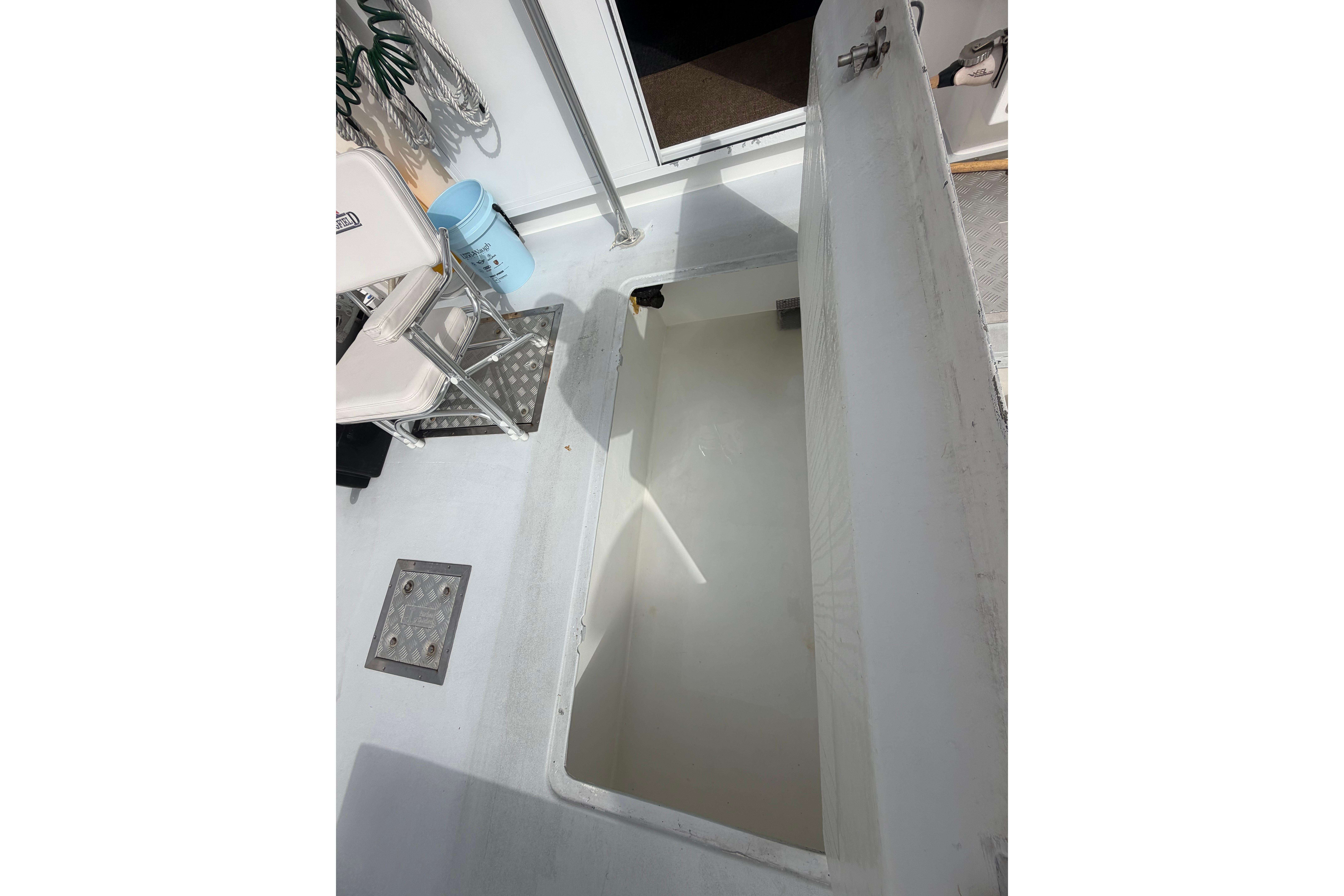 Open hatch on 2018 H&H Marine Osmond Beal boat deck, showing interior compartment.