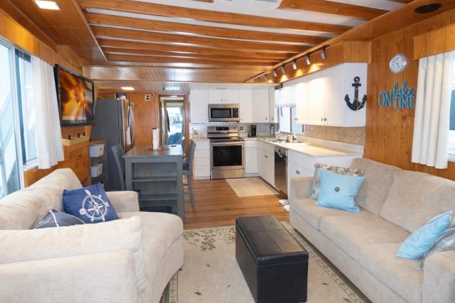 Cozy 1987 Sumerset 14x64 houseboat interior with modern kitchen and comfortable living area.